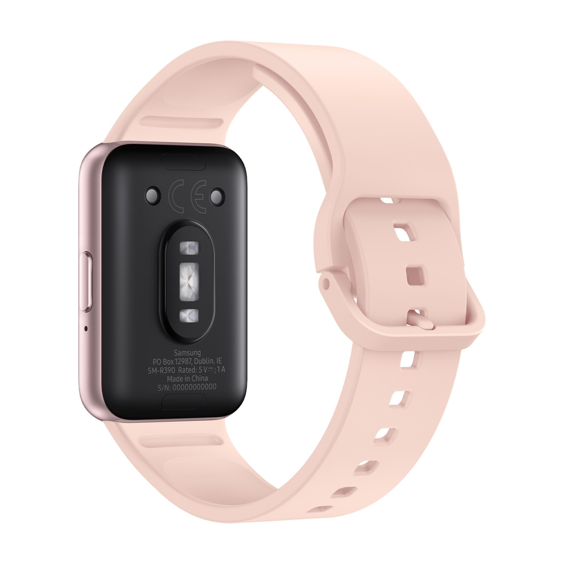 Ein rosafarbenes Smartwatch-Armband mit schwarzem Gehäuse und silbernen Sensoren.
