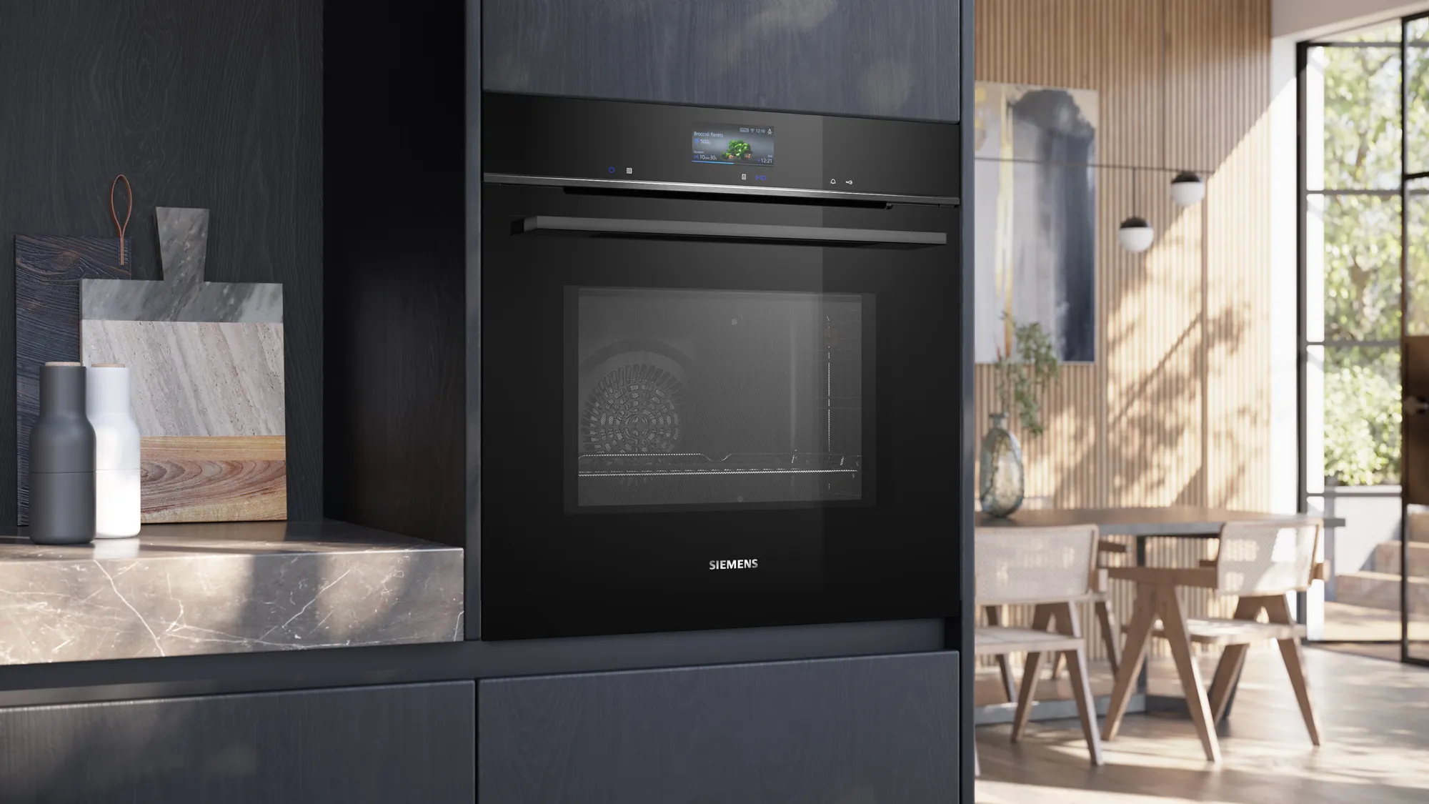 Moderne zwarte Siemens inbouwoven met touchscreen en glazen deur.