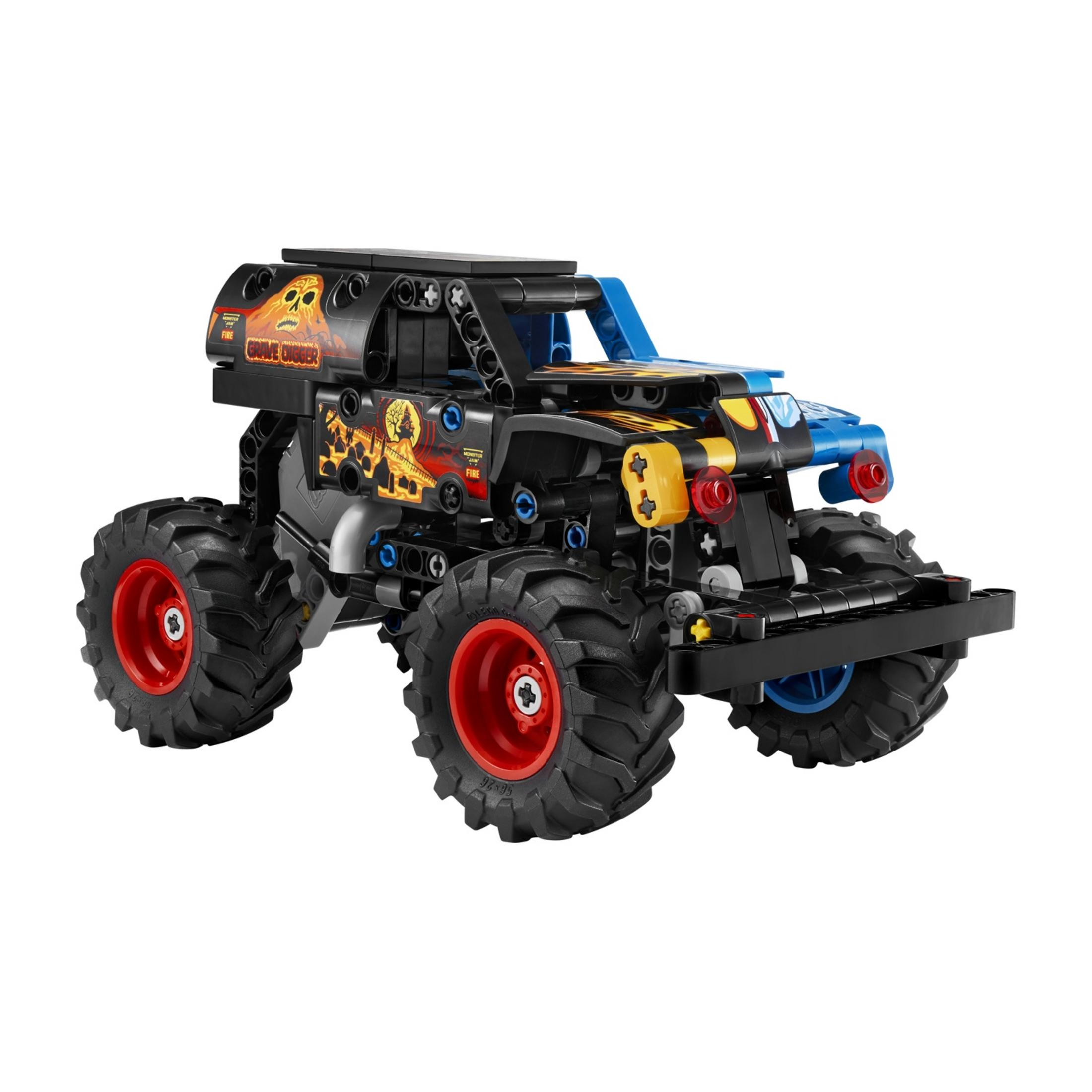 Un monster truck negro de Lego con neumáticos grandes y llantas rojas.