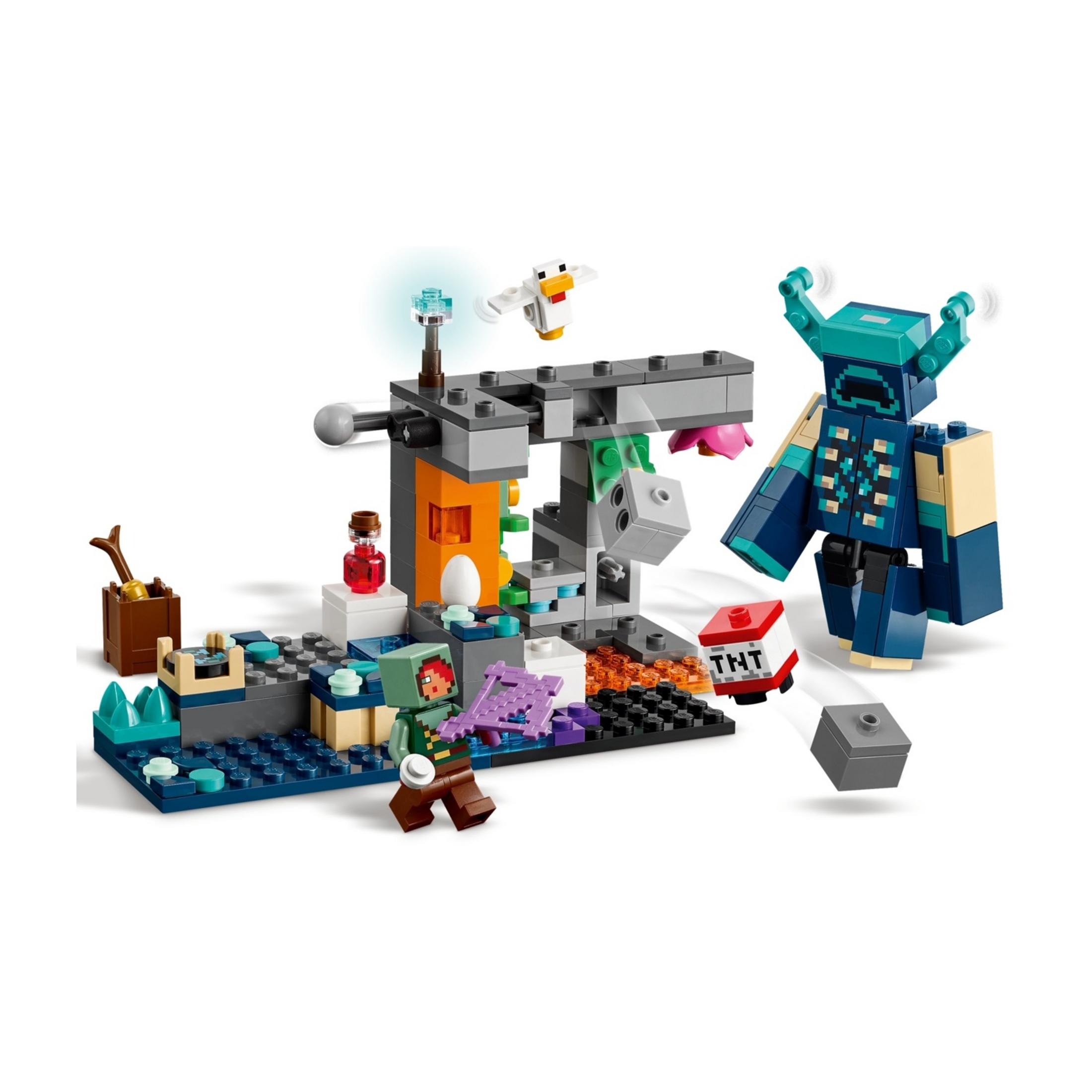Zestaw konstrukcyjny Minecraft z figurkami, TNT i dużym niebieskim stworzeniem.