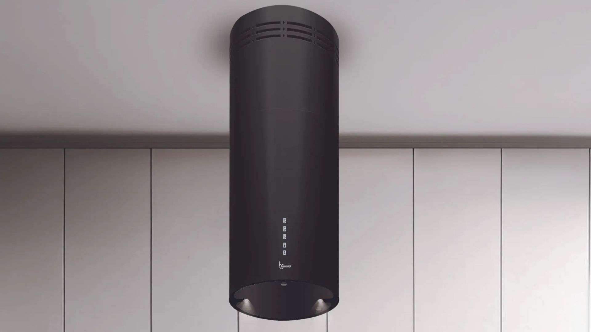 Cappa aspirante cilindrica nera appesa al soffitto sopra i mobili.