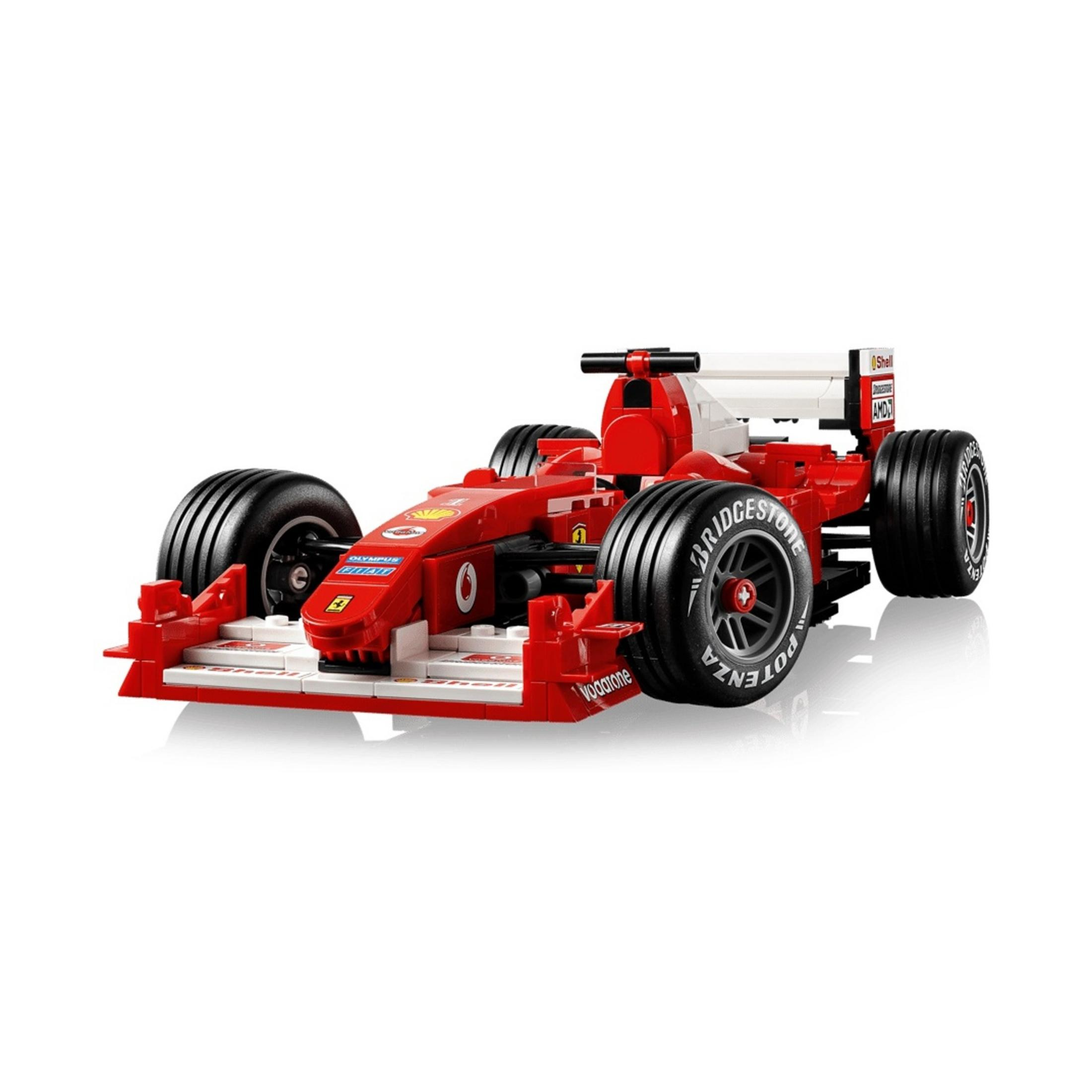 Czerwony samochód wyścigowy Formuły 1 z klocków Lego z naklejkami sponsorów.