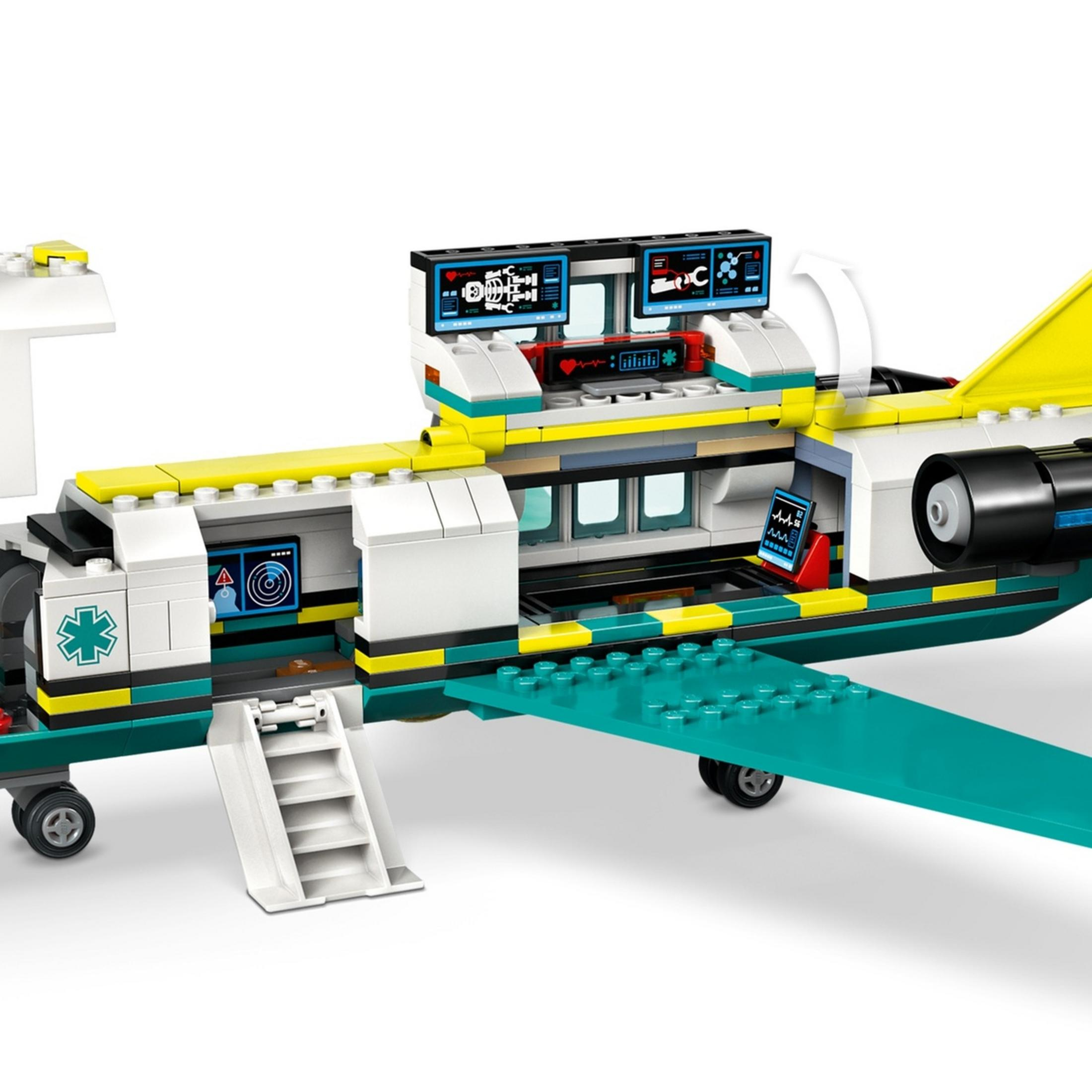 Zabawkowy samolot medyczny Lego z otwartymi drzwiami i widocznymi ekranami.