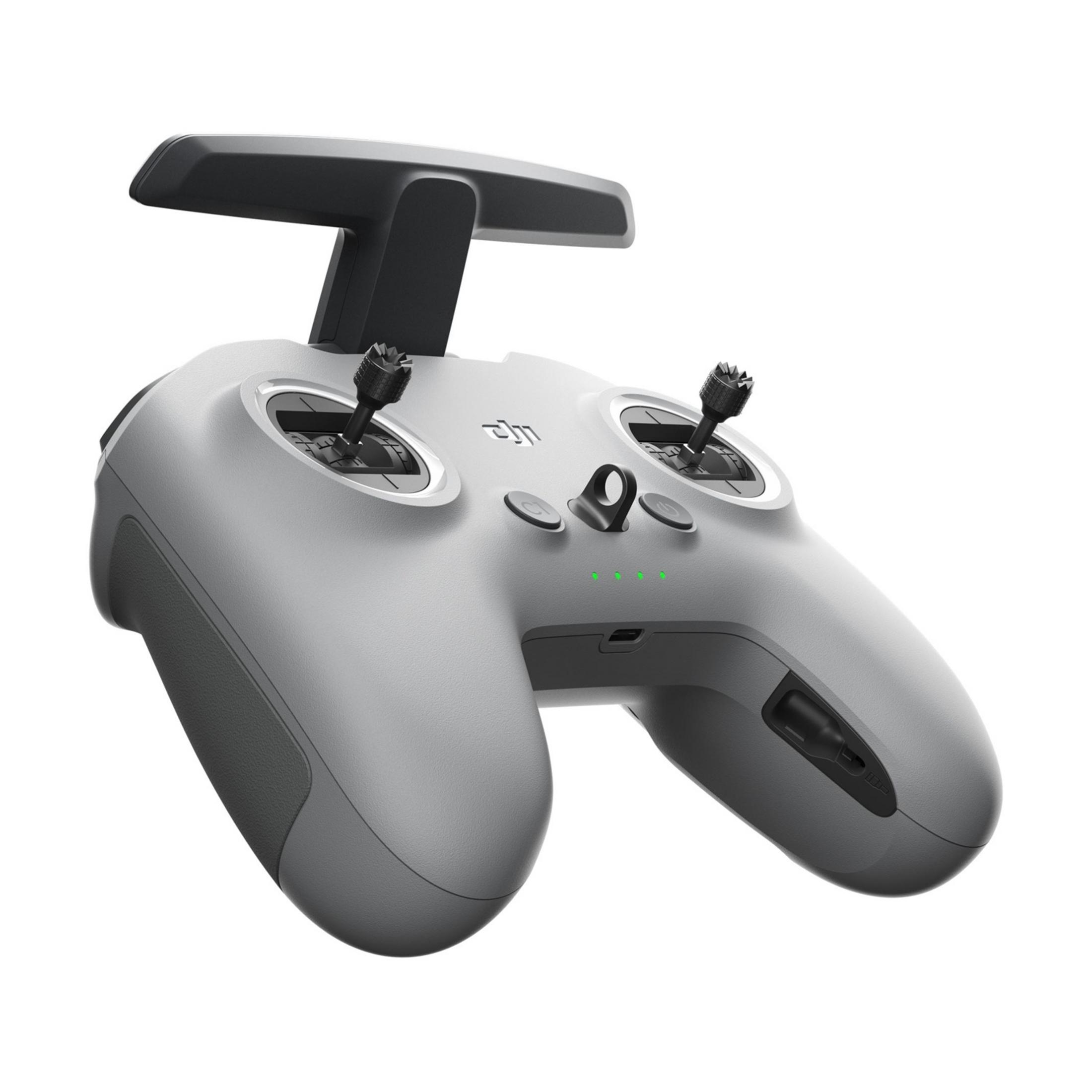 Grauer ferngesteuerter Controller mit Joysticks und Knöpfen, isoliert auf Weiß.