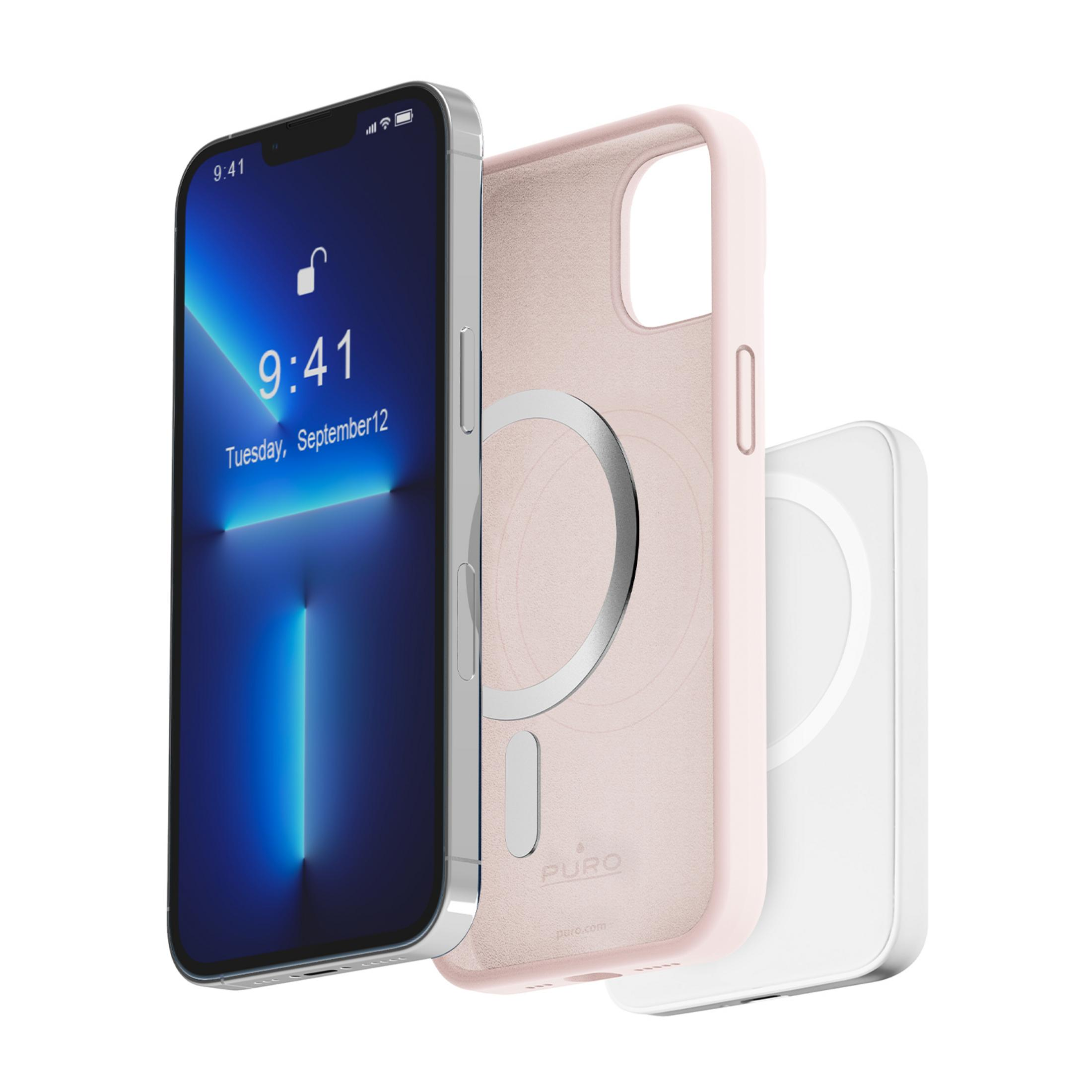 Un iPhone argentato con cover rosa e caricatore MagSafe bianco accanto.