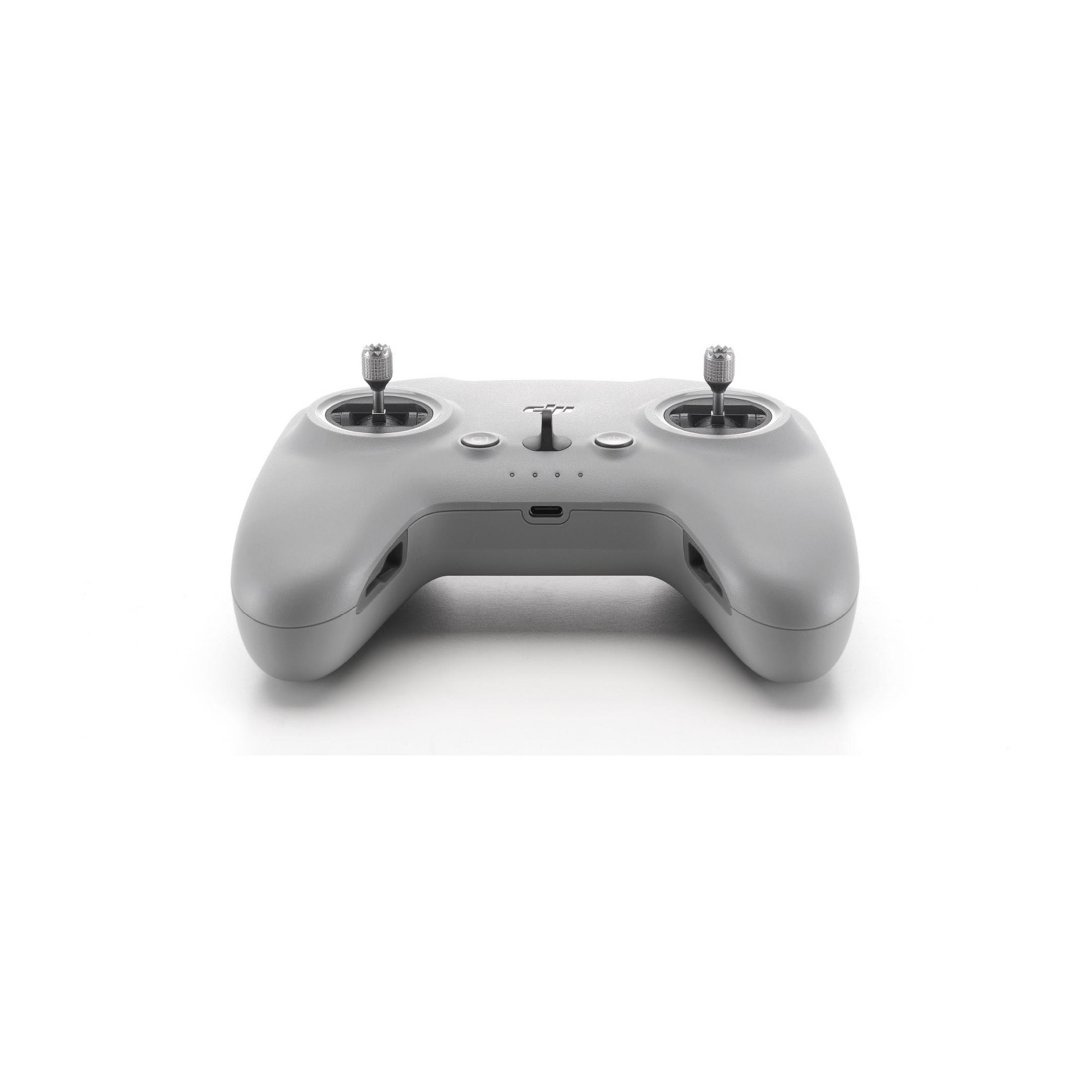 Un controller per droni grigio con due joystick e pulsanti, su sfondo bianco.
