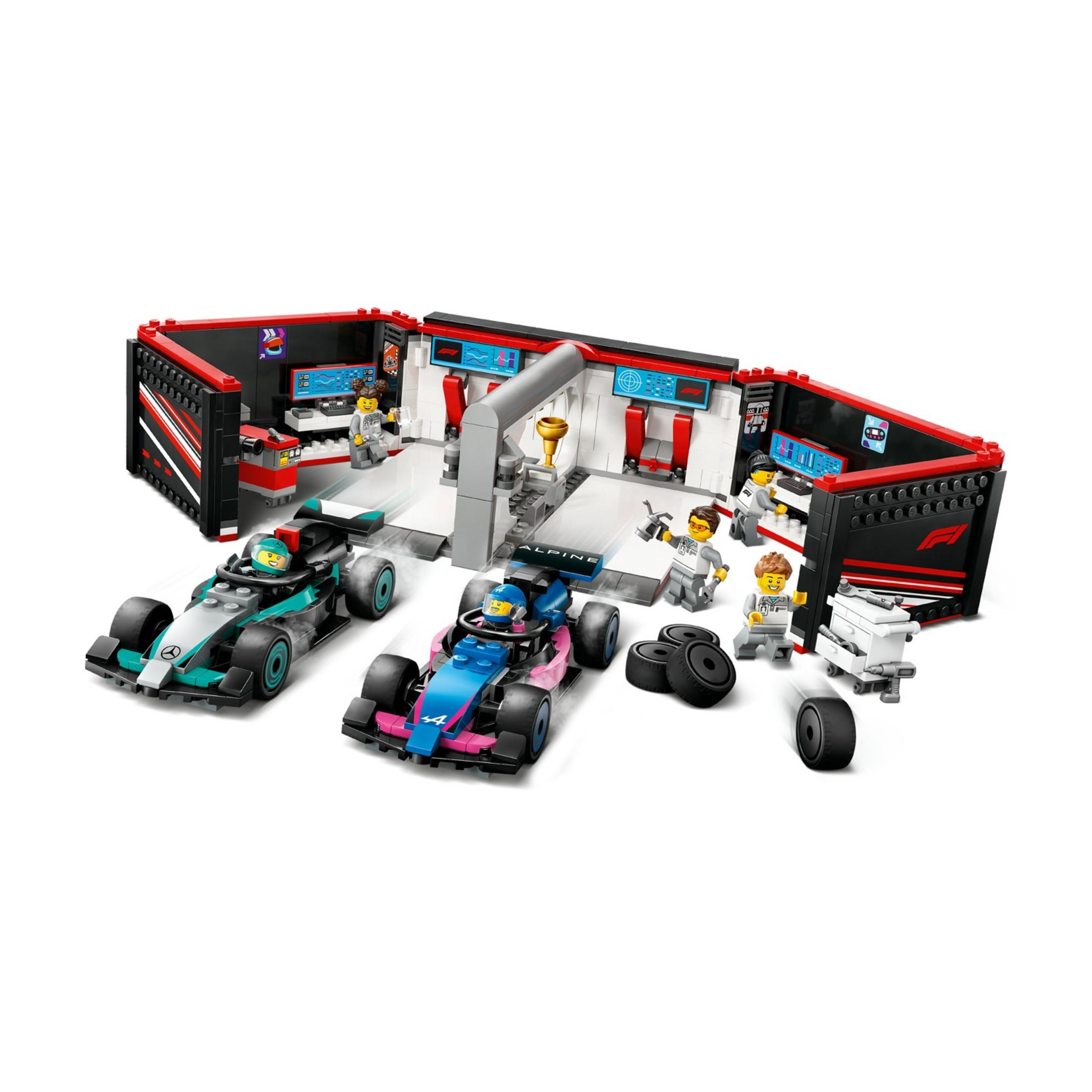 Scena pit stop Formuły 1 z dwoma samochodami, mechanikami i narzędziami.