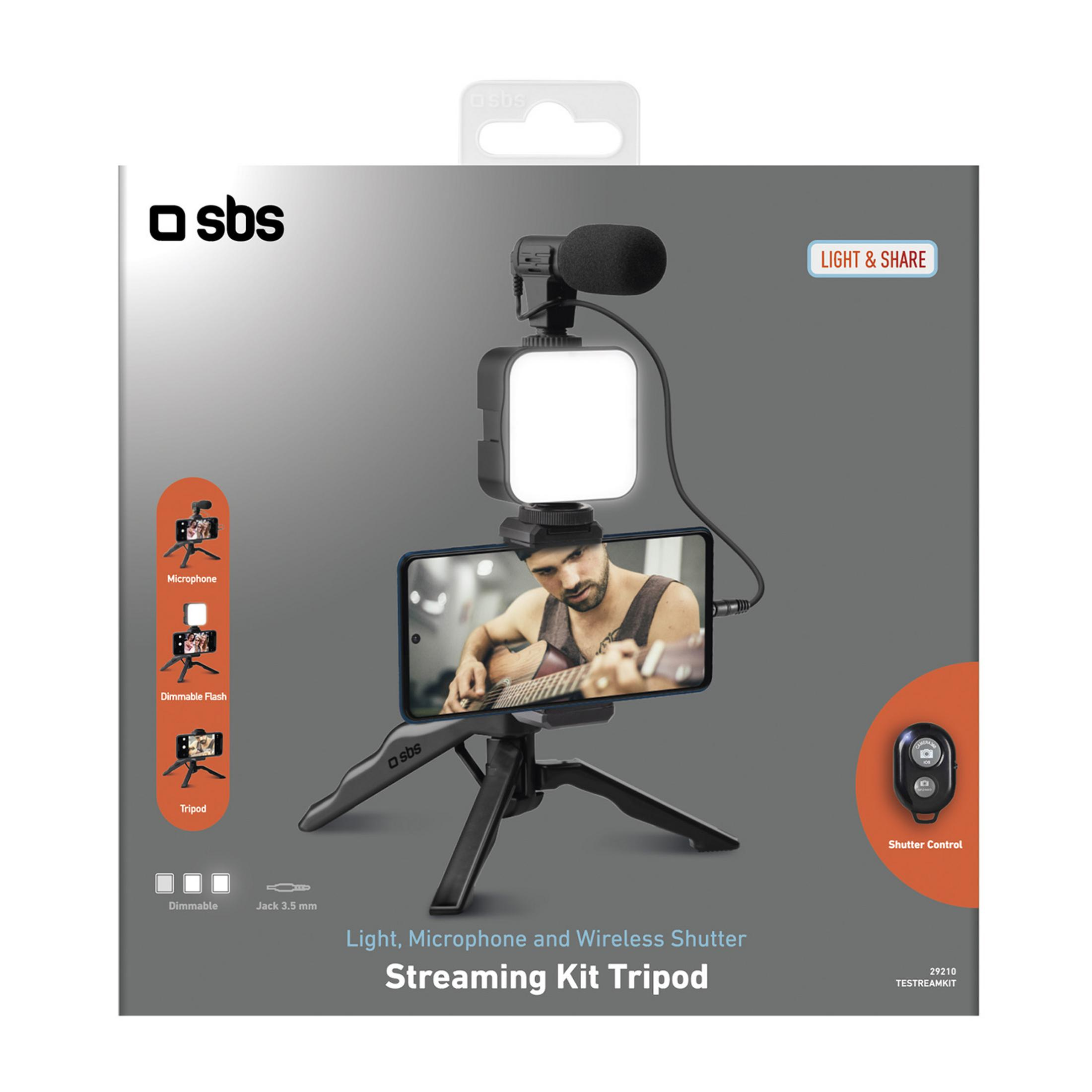 Un kit de streaming con teléfono, micrófono, luz y control remoto en un trípode.