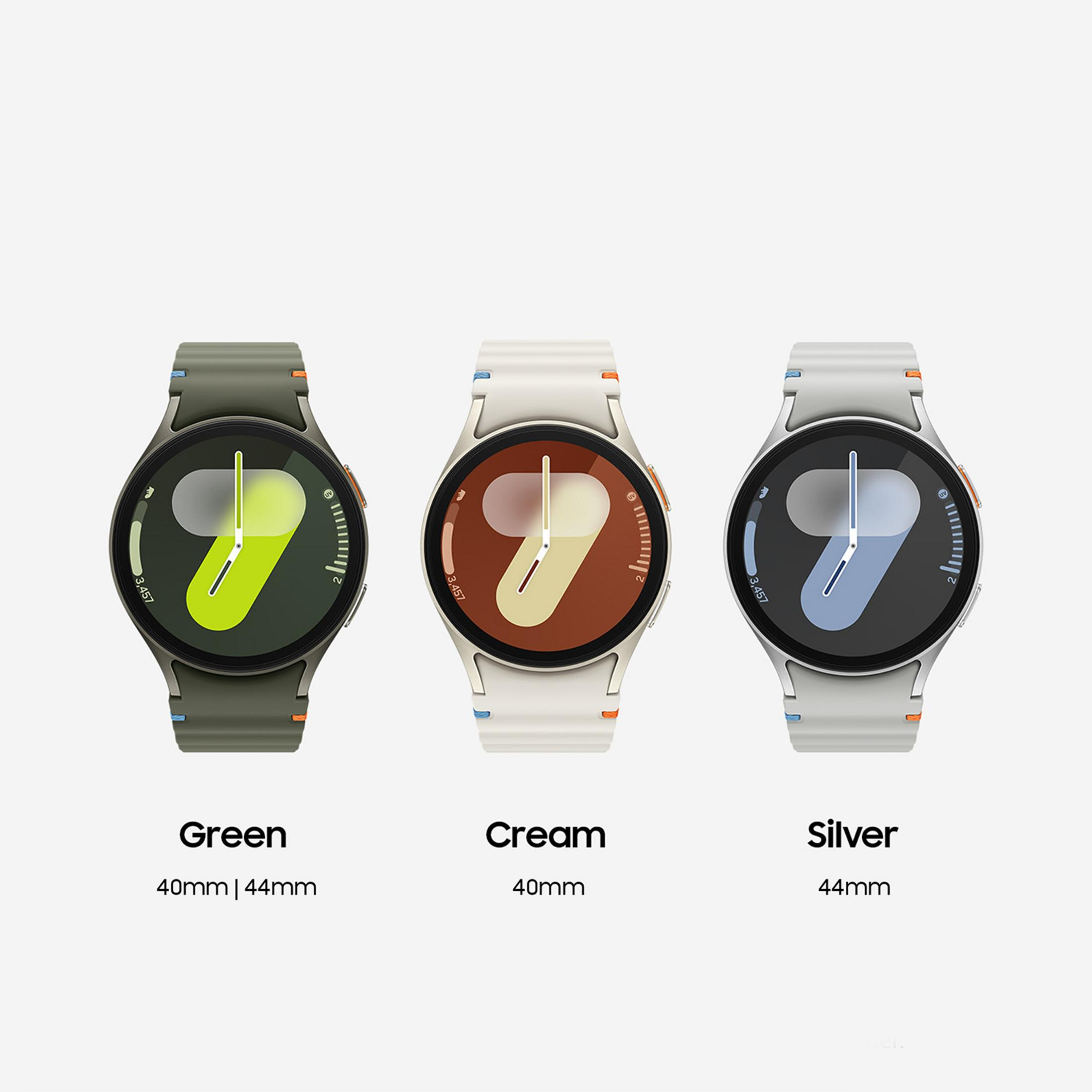 Drie smartwatches in groen, crème en zilver met wijzerplaten.