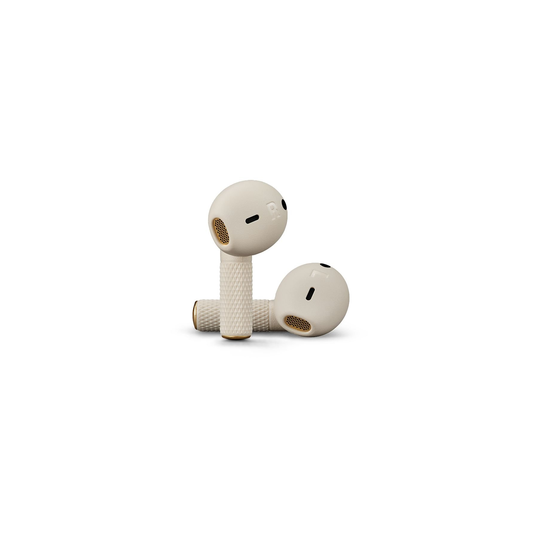 Due auricolari color crema con accenti dorati giacciono uno accanto all'altro.