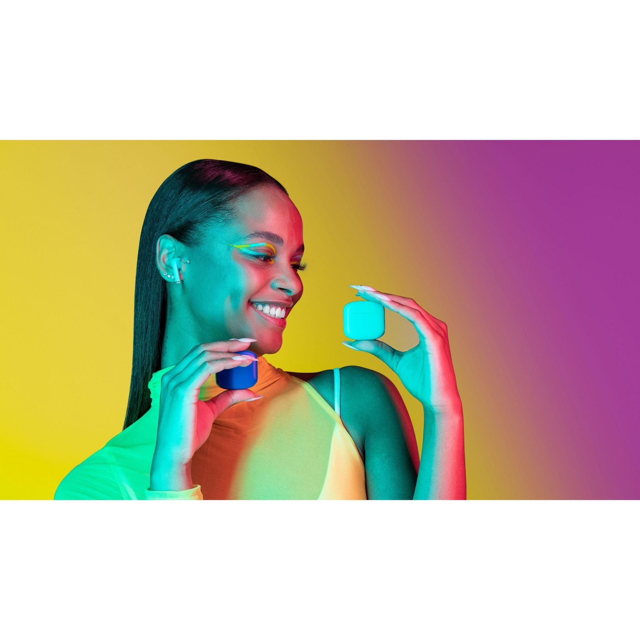 Woman holds blue and teal cubes against a yellow-purple background.