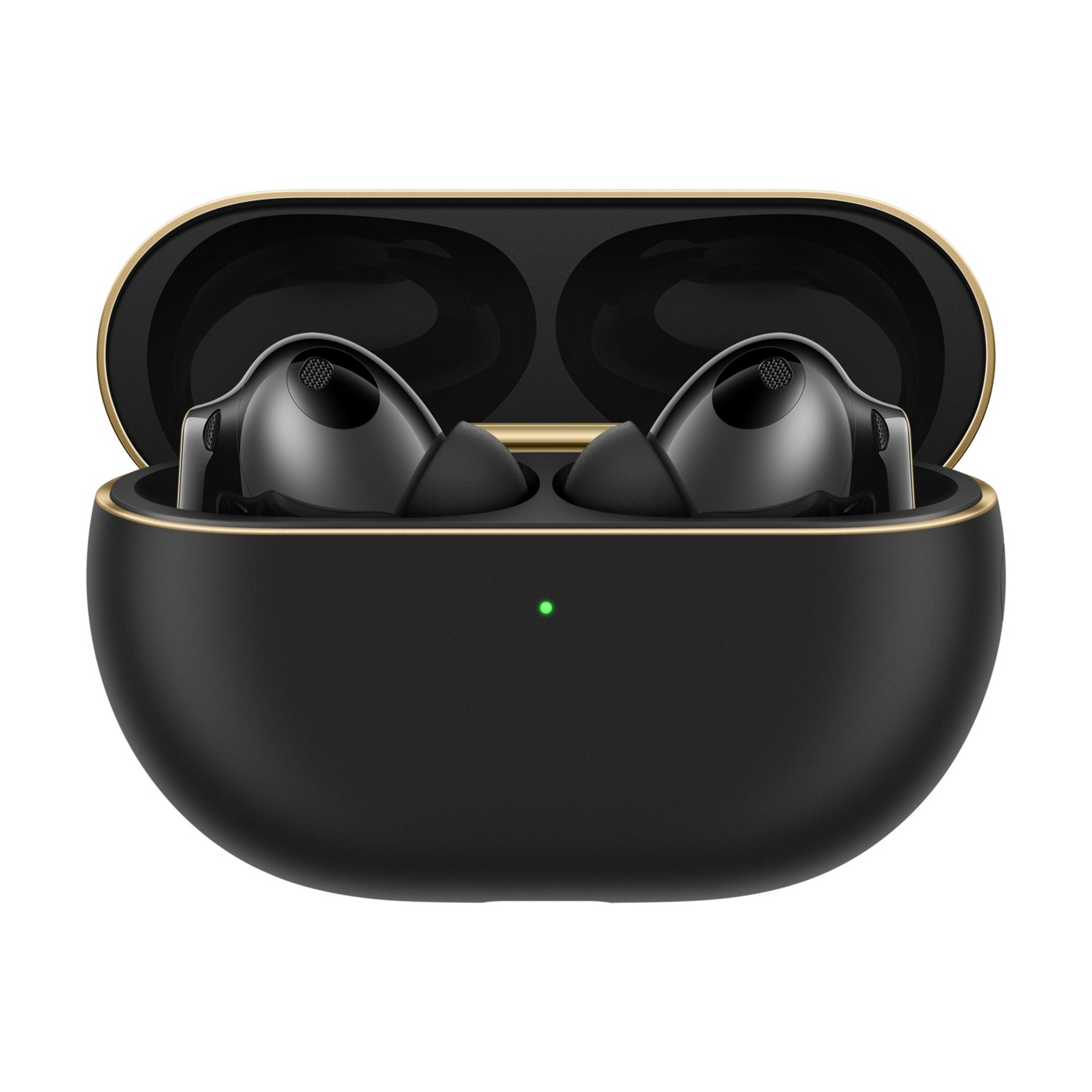 Czarne słuchawki bezprzewodowe w otwartym etui ładującym ze złotą krawędzią i zieloną diodą.