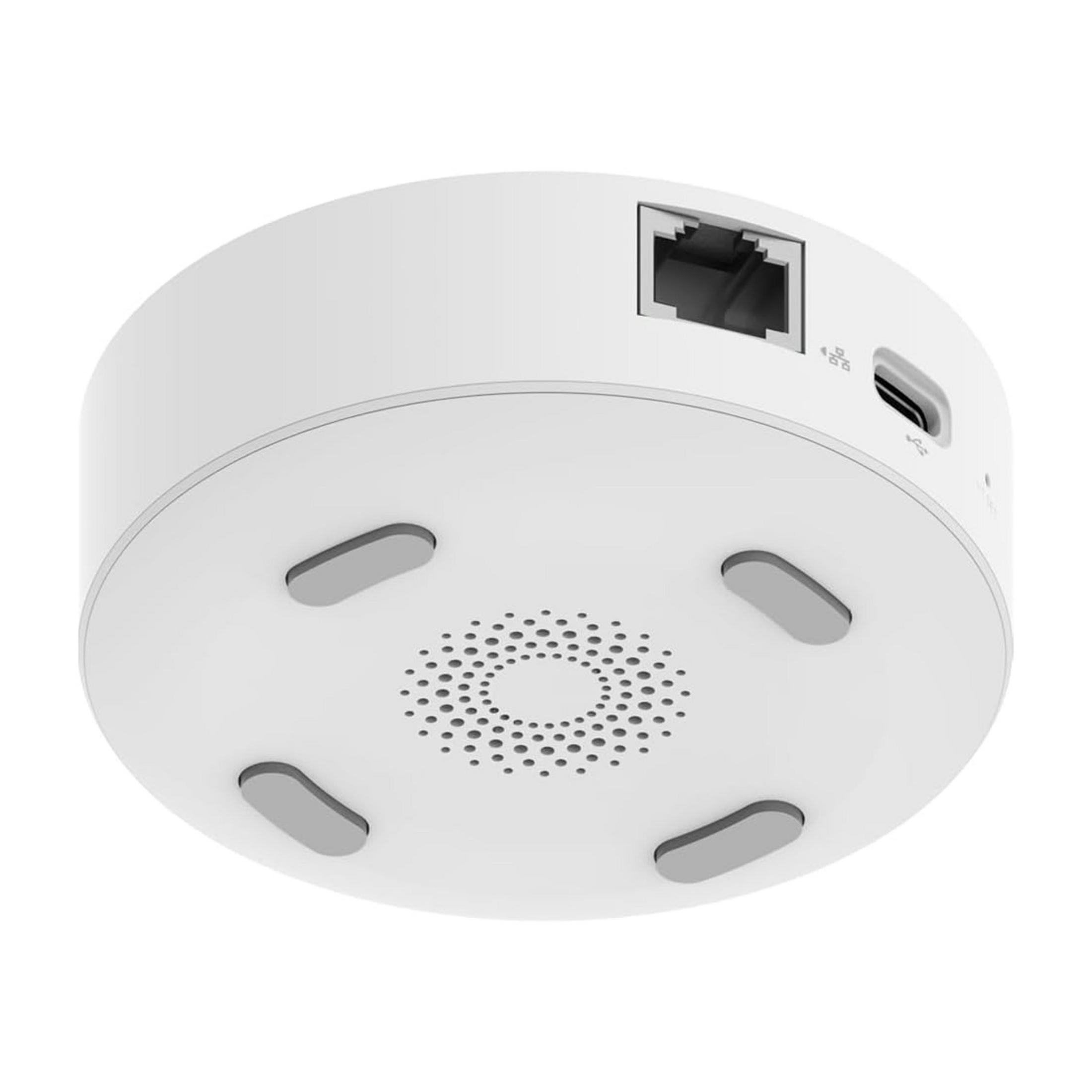 Białe, okrągłe urządzenie z portem Ethernet, USB-C i maskownicą głośnika.
