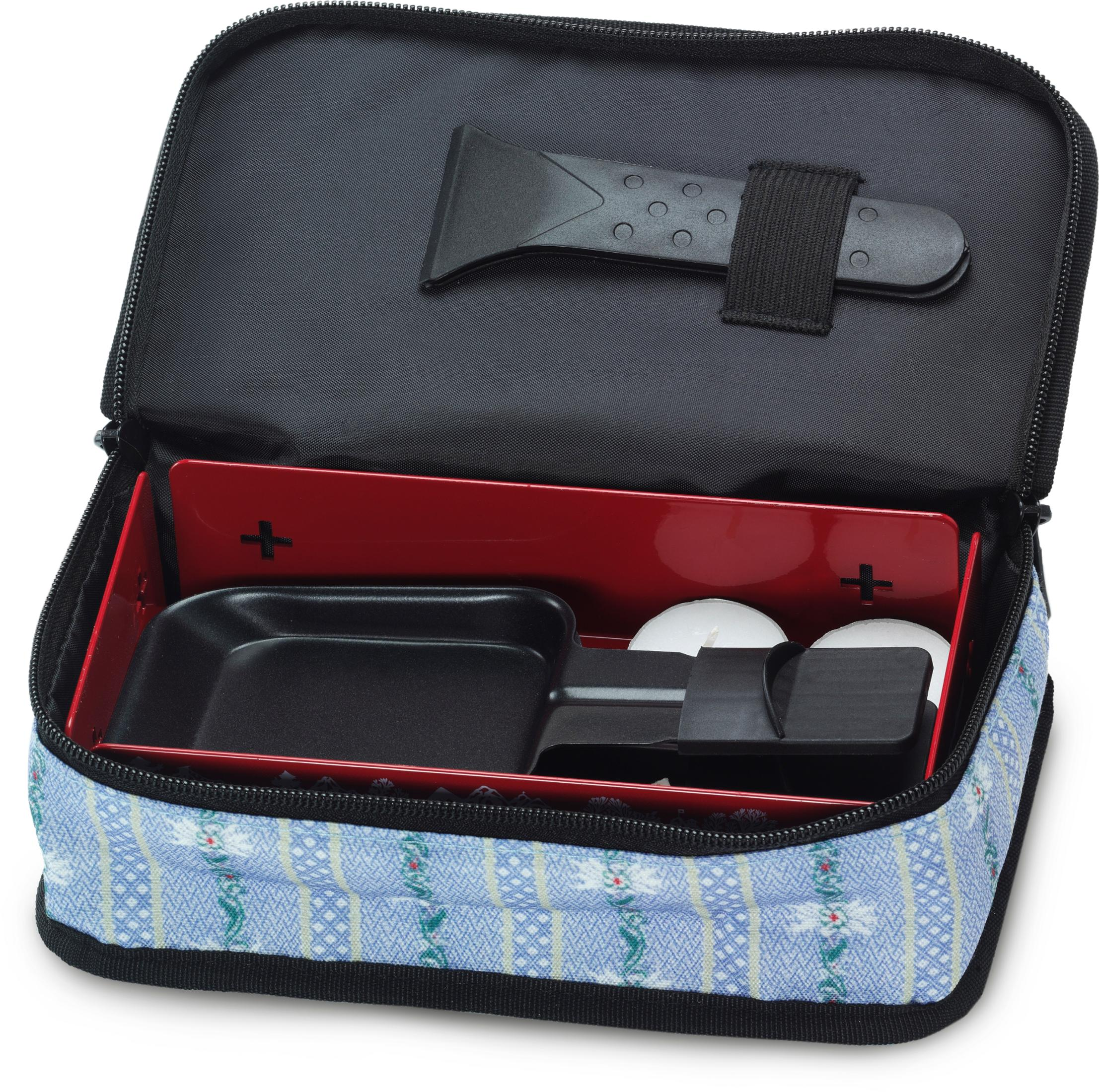 Borsa blu aperta con raschietto per ghiaccio e candele per fonduta.