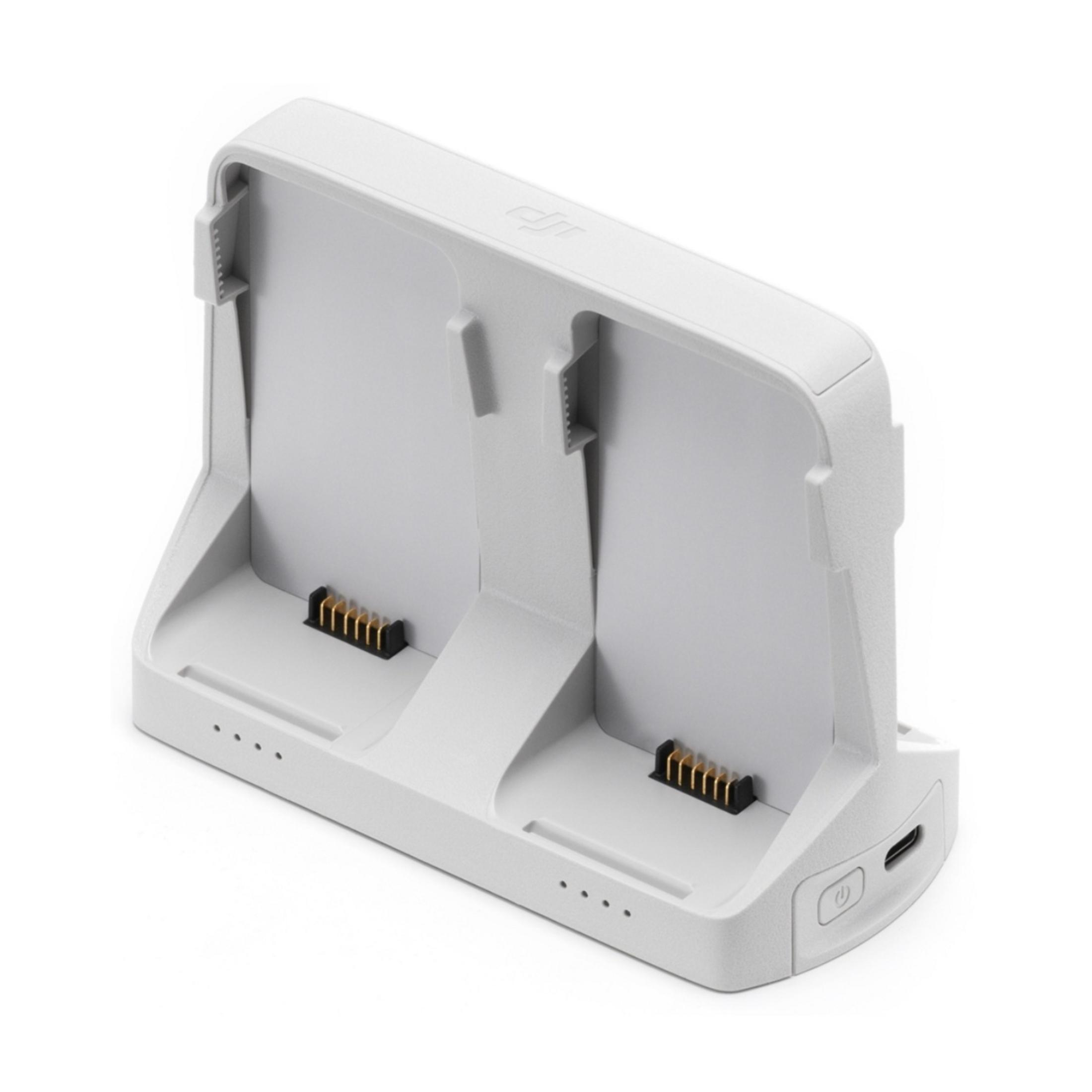 Un hub di ricarica bianco DJI per due batterie con spie.