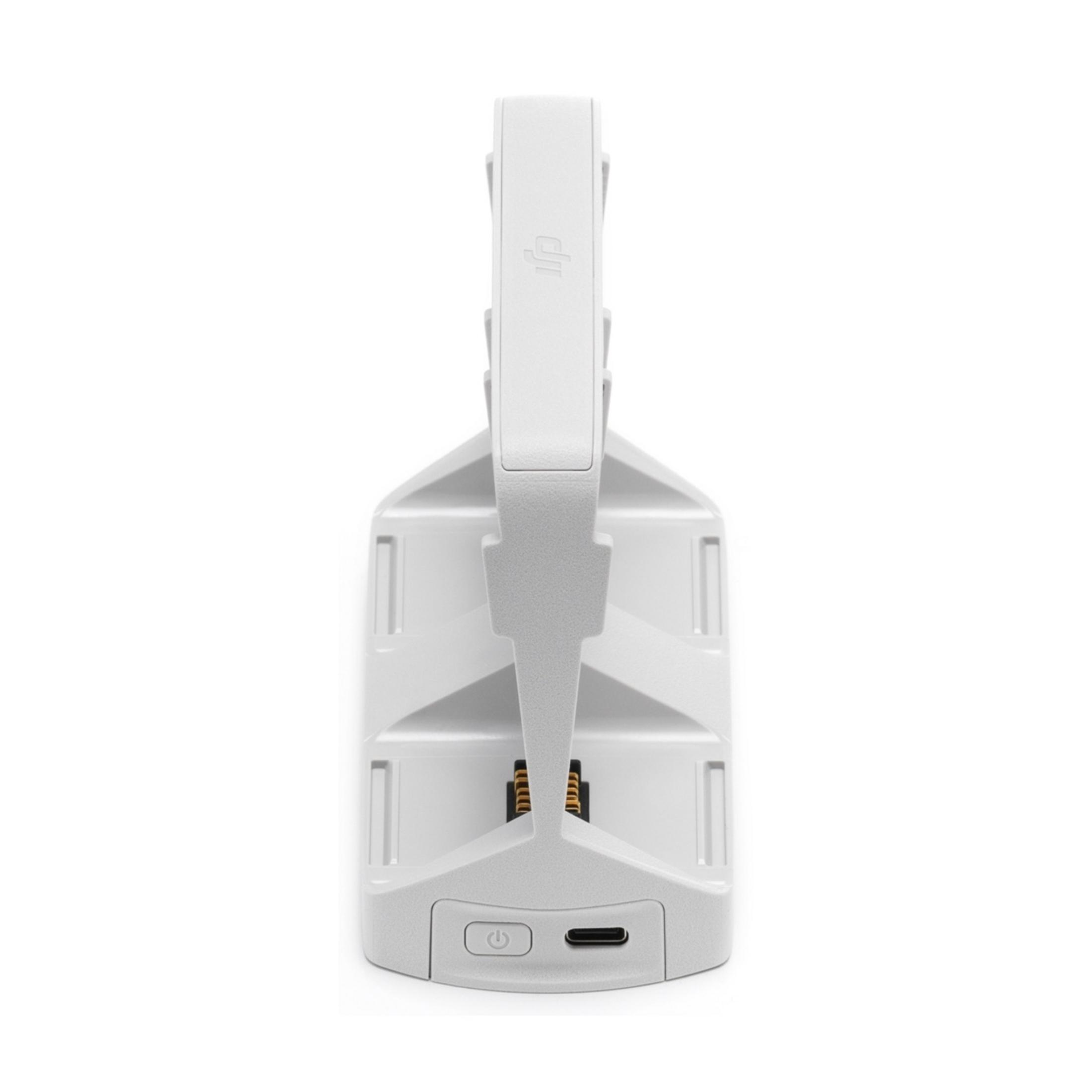 Una base di ricarica bianca con pulsante di accensione e porta USB-C.