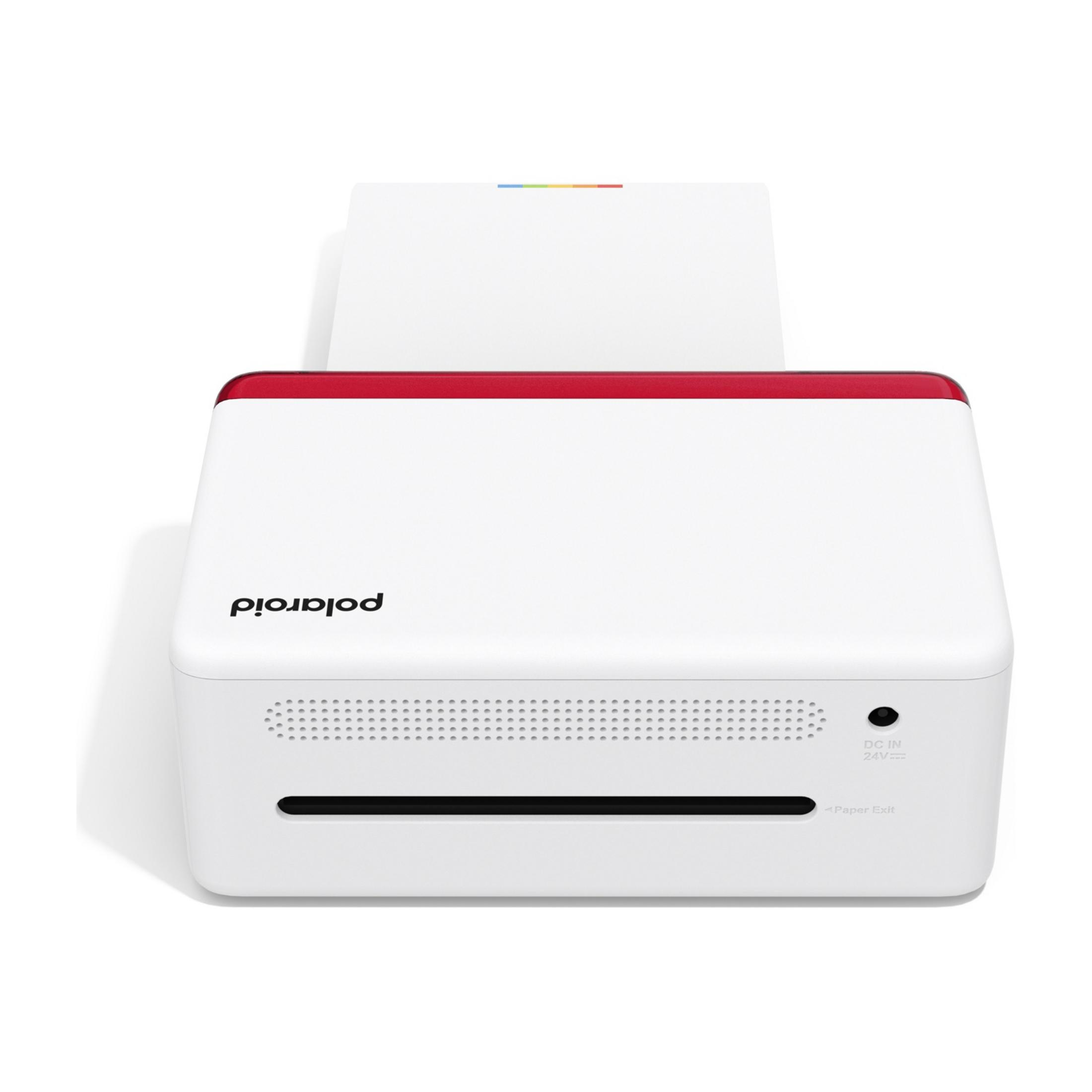 Biała drukarka Polaroid z czerwonym rantem i otworem na papier.