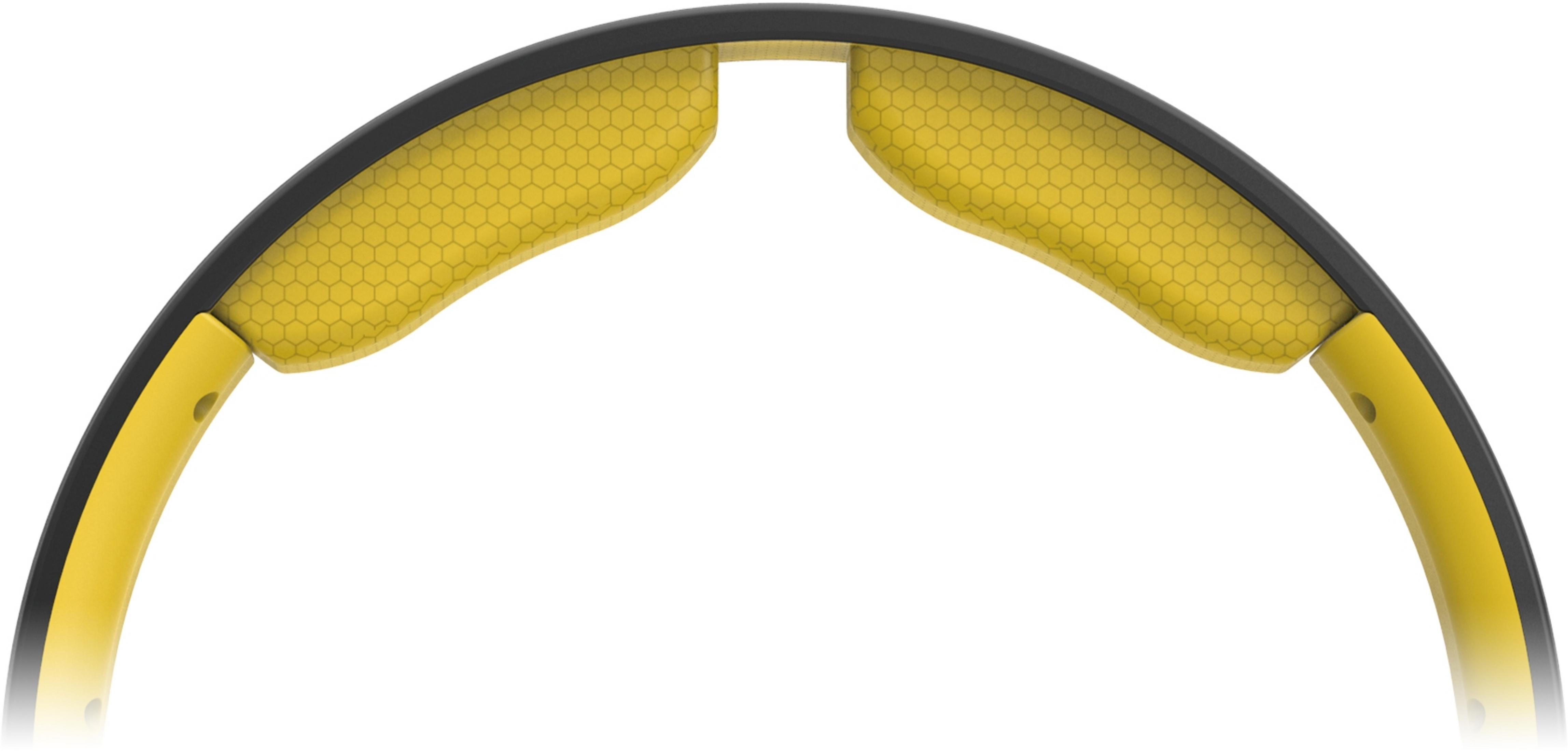 Acolchado amarillo con patrón de panal en marco negro.