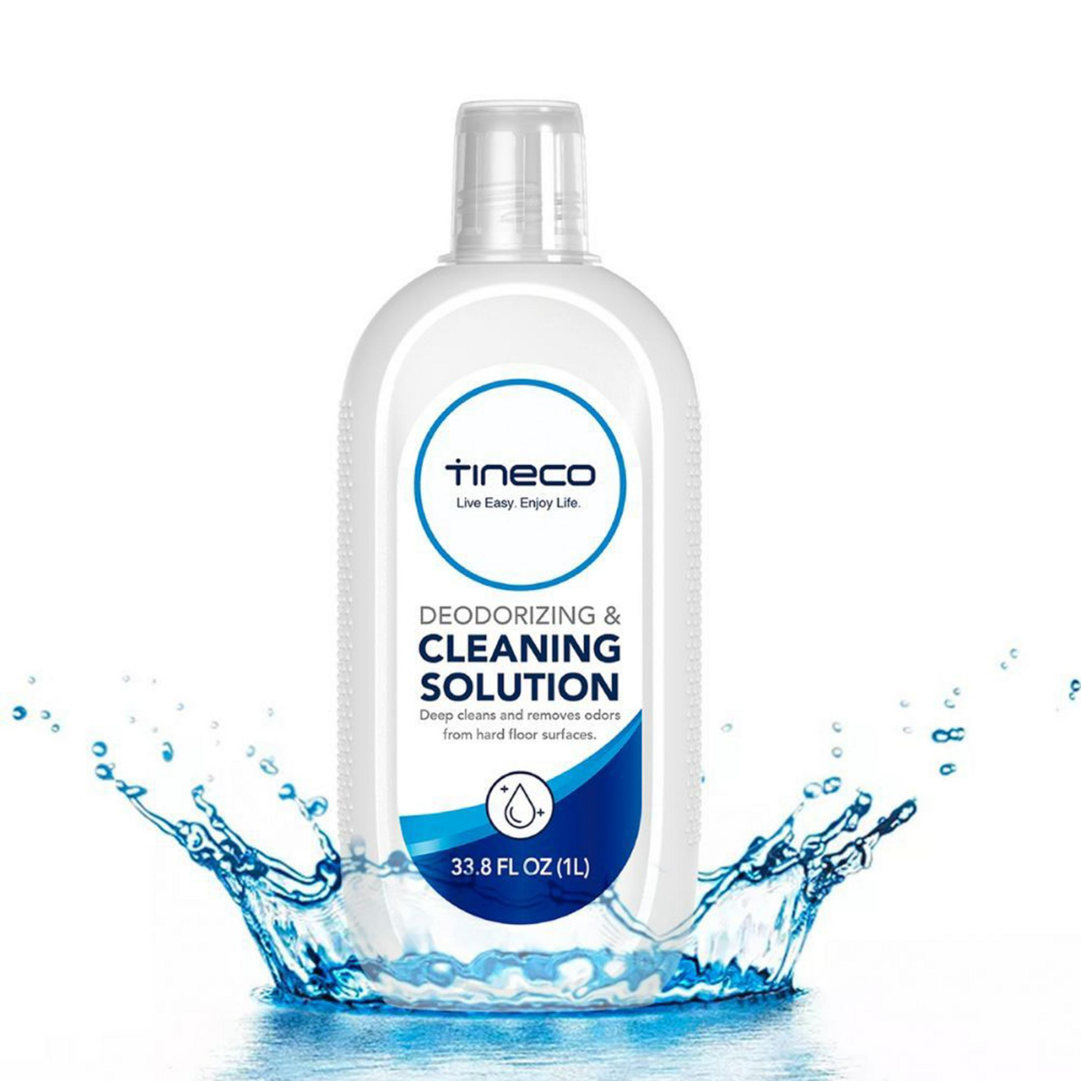 Una bottiglia bianca di soluzione detergente Tineco con schizzi d'acqua. 33,8 oz (1L).