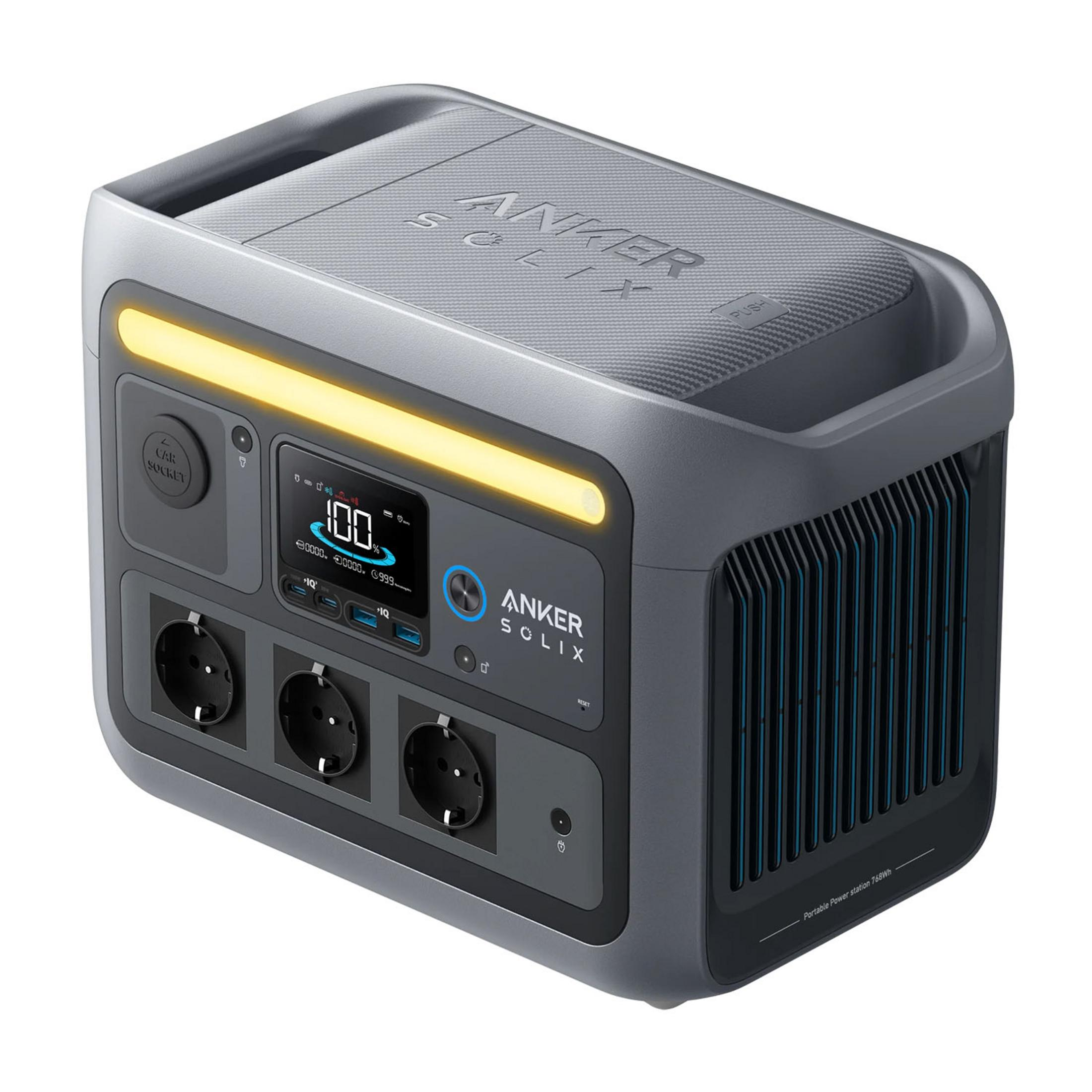 Szara przenośna stacja zasilania Anker Solix z gniazdkami, ekranem i żółtym światłem.
