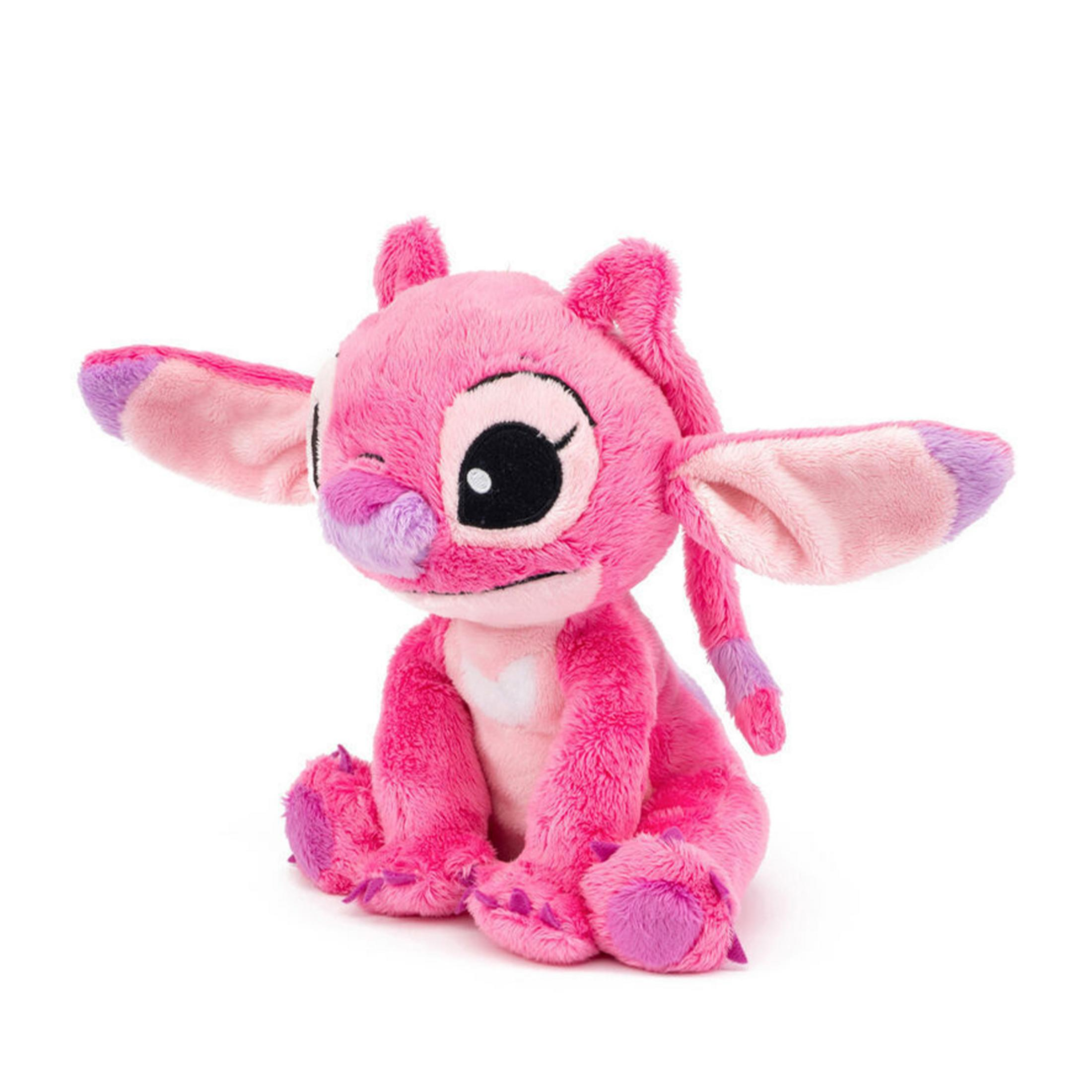 Une peluche rose avec de grandes oreilles et des accents violets est assise.