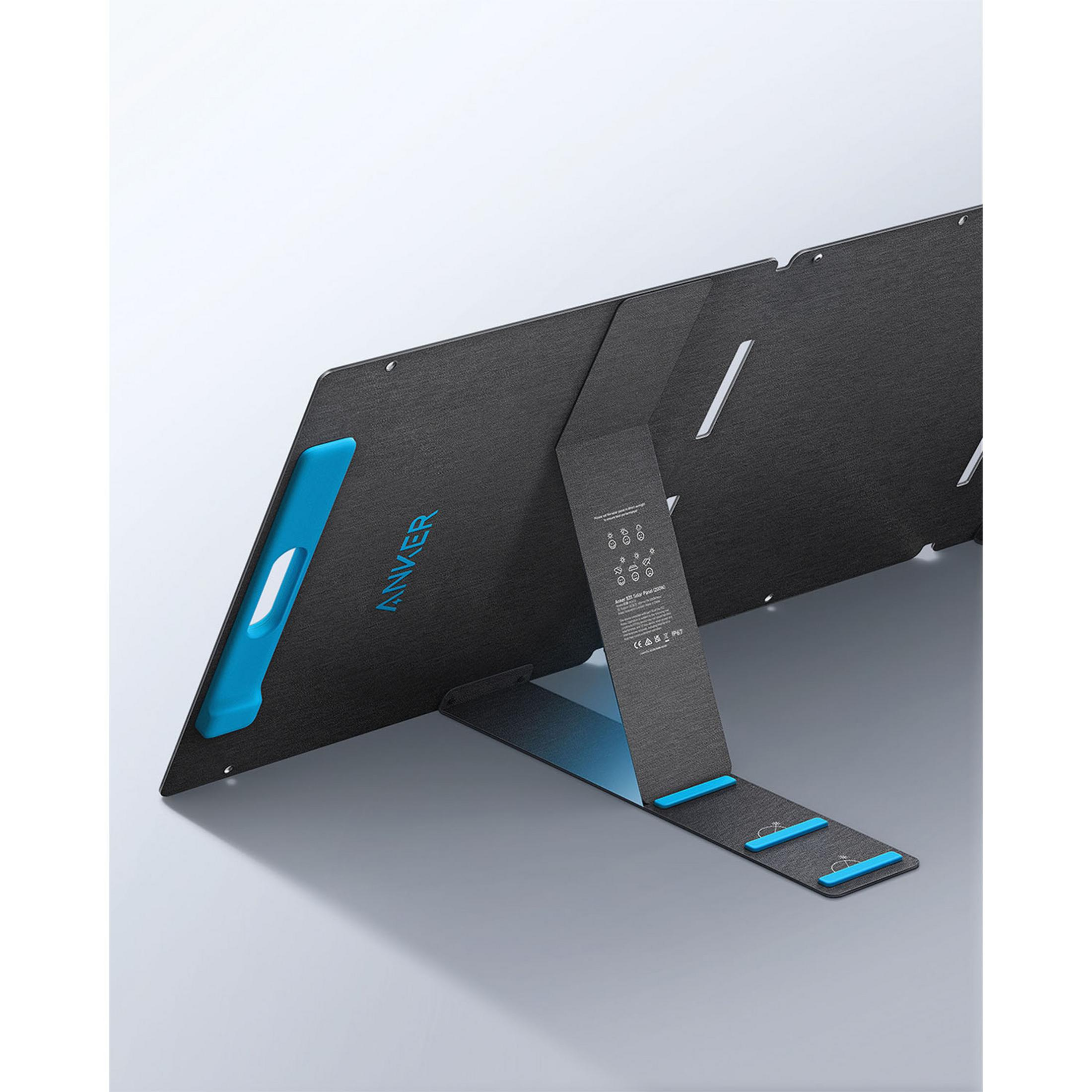 Czarny panel słoneczny z niebieskimi akcentami stoi na podpórce.