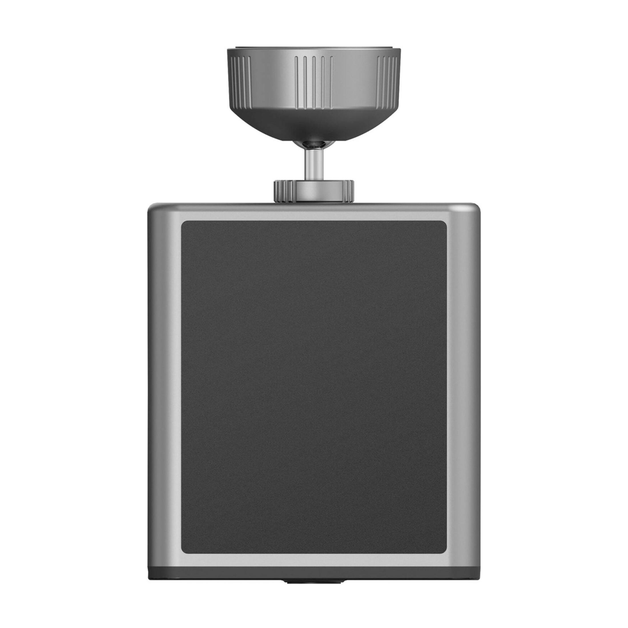 Srebrna kostka z czarnym przodem i pokrętłem na górze.