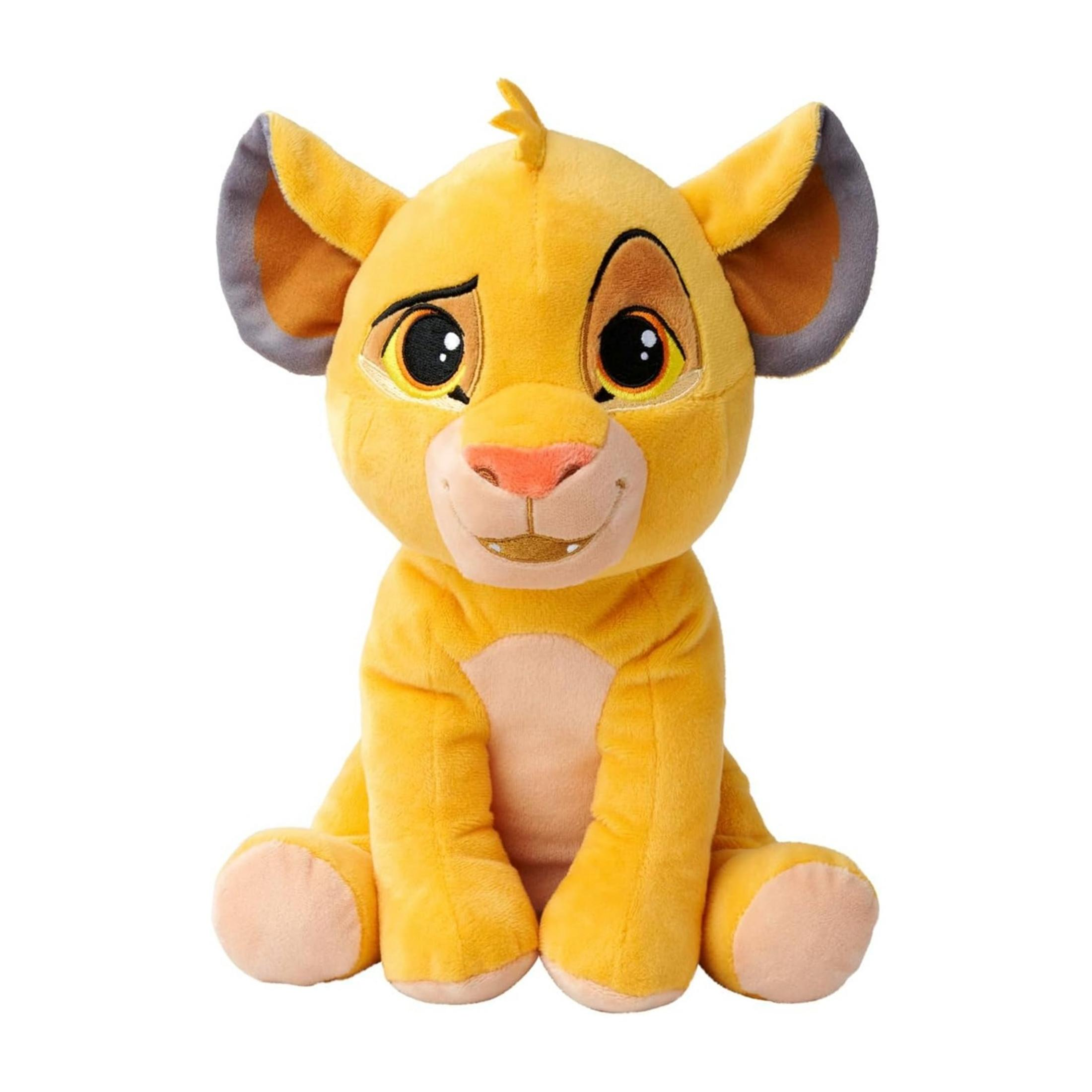 Un peluche giallo di un cucciolo di leone è seduto dritto.