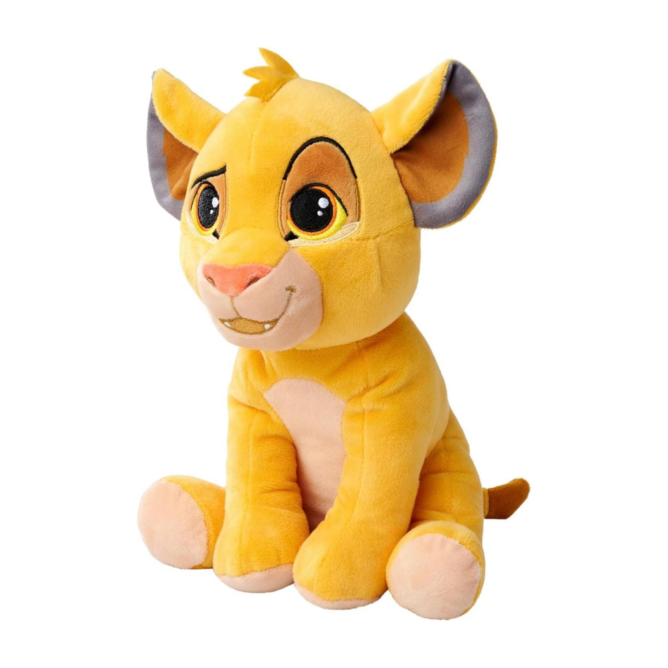 Un leone di peluche giallo seduto guarda a sinistra. Ha grandi occhi e naso rosa.