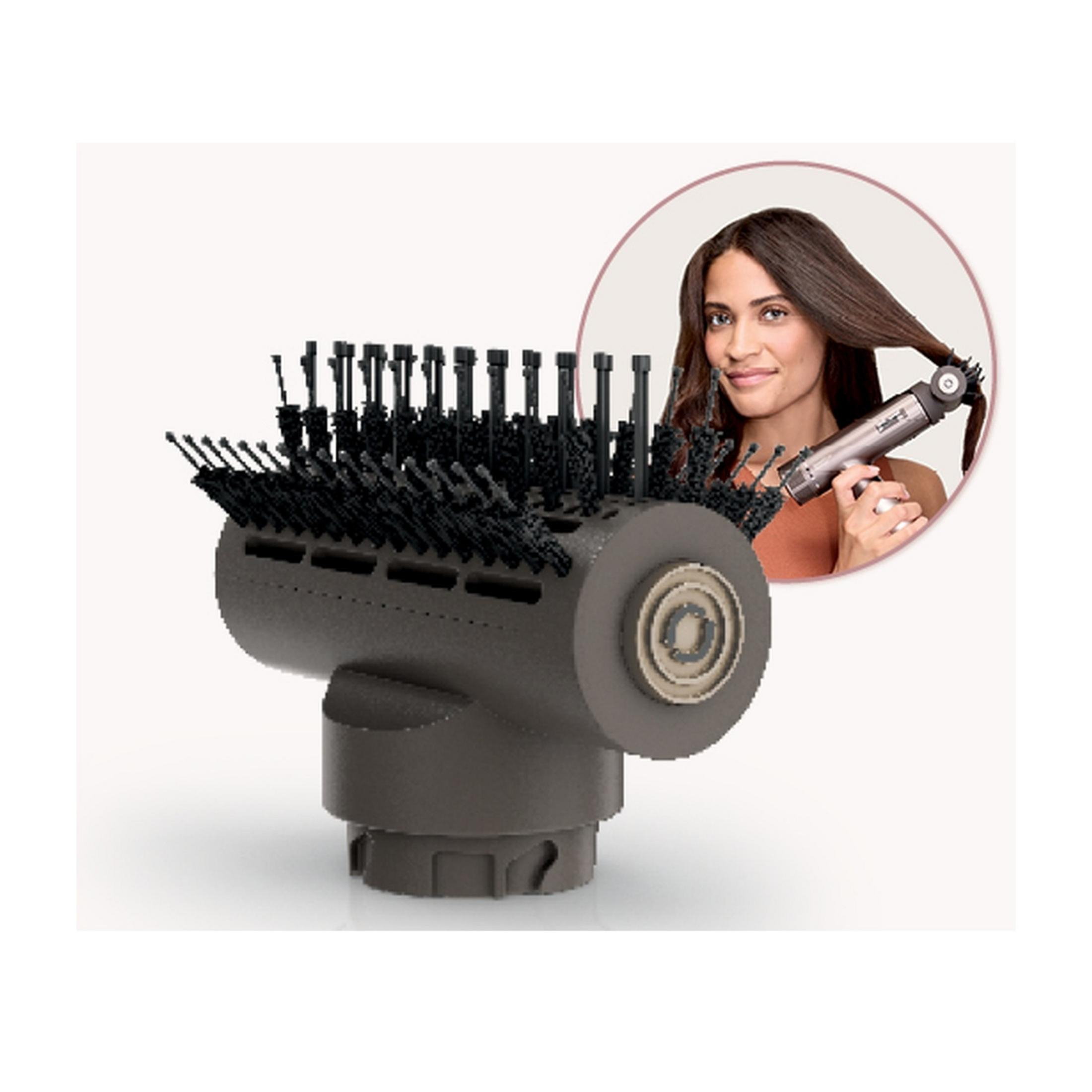 A dark brush attachment with black bristles and a woman styling her hair.