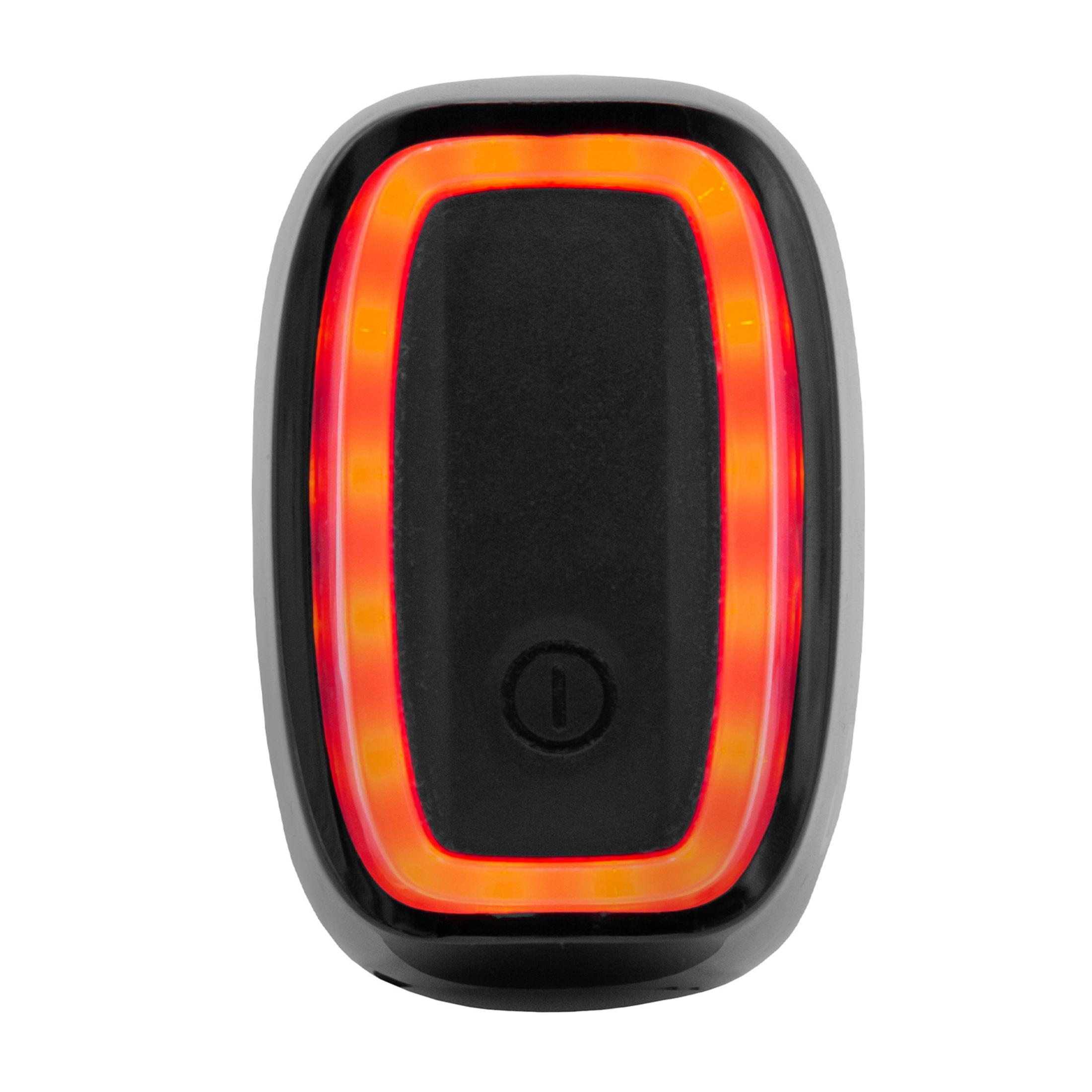 Dispositivo nero con anello luminoso rosso e arancione e un simbolo di accensione.