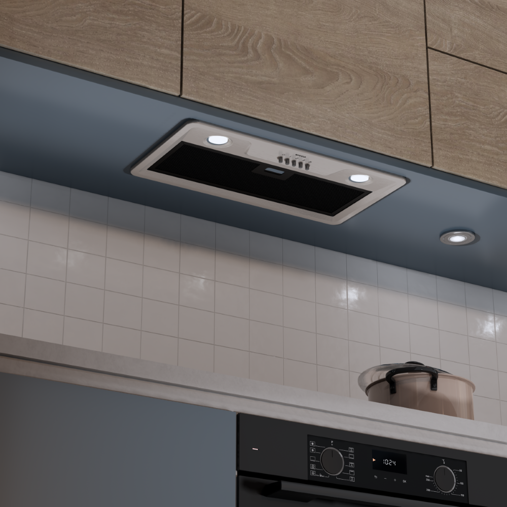 A range hood above a tiled wall with a pot and an oven.