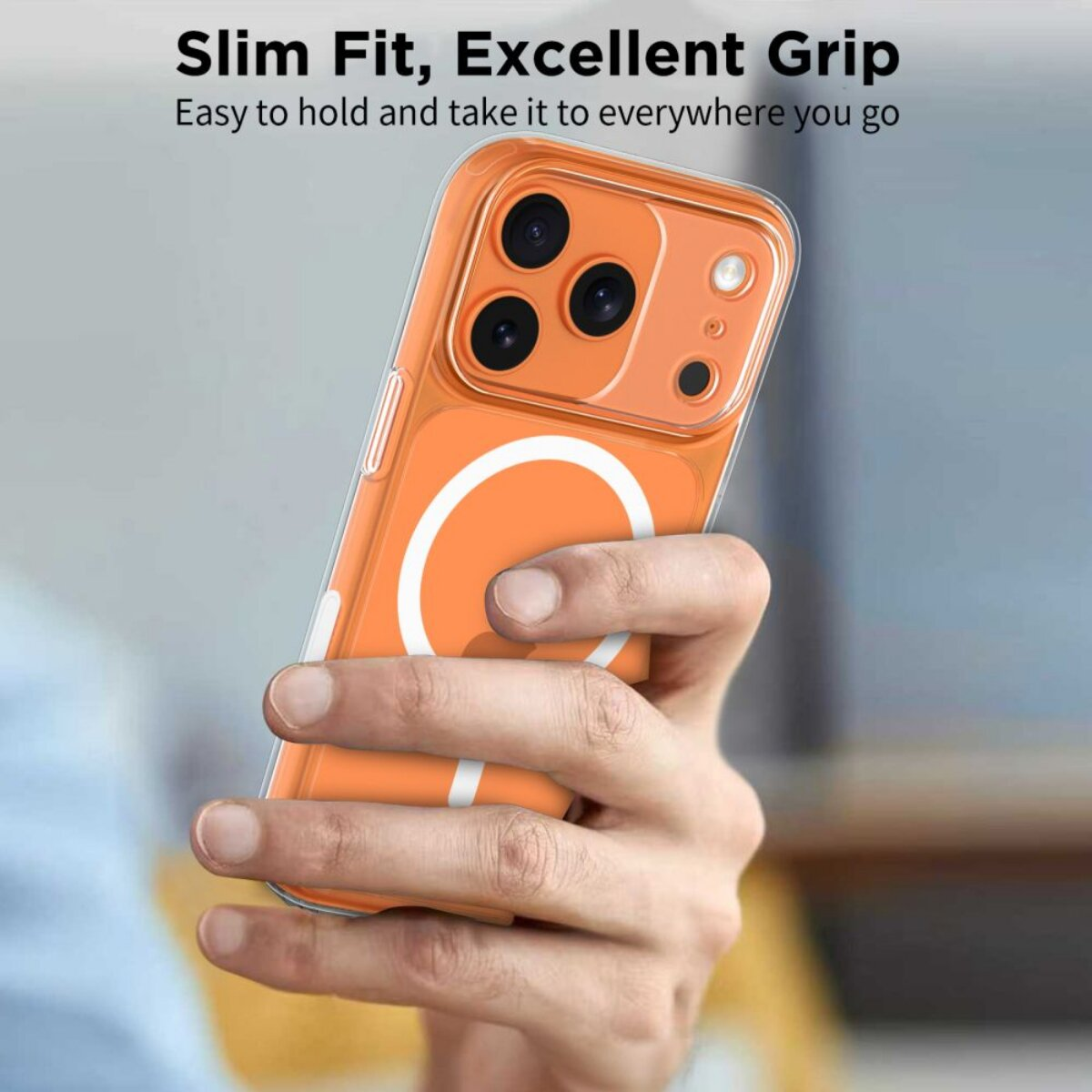 Hand hält ein orangefarbenes Handy mit einer durchsichtigen Hülle.