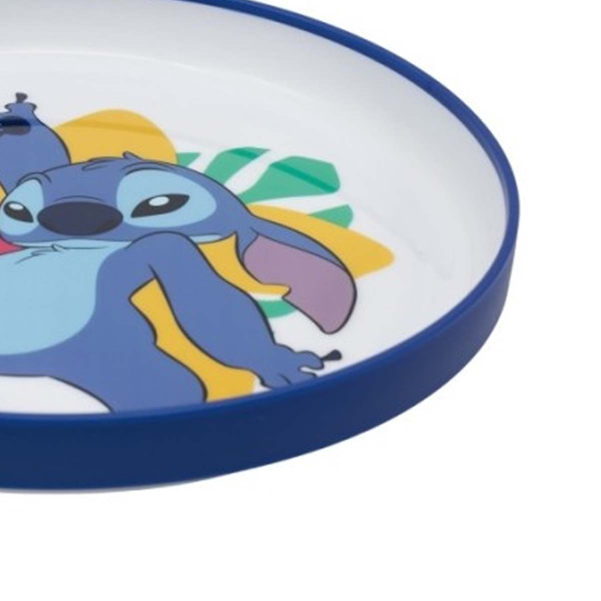 Piatto blu con disegno di Stitch e foglie tropicali.