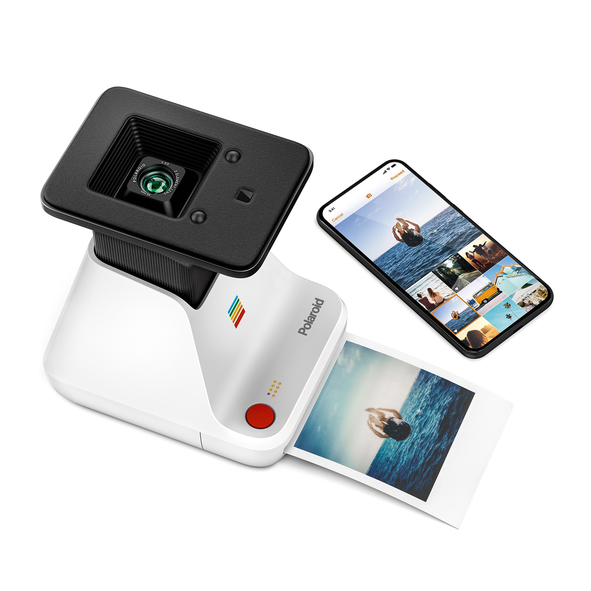 Fotocamera istantanea Polaroid con smartphone e foto stampata di un sub.