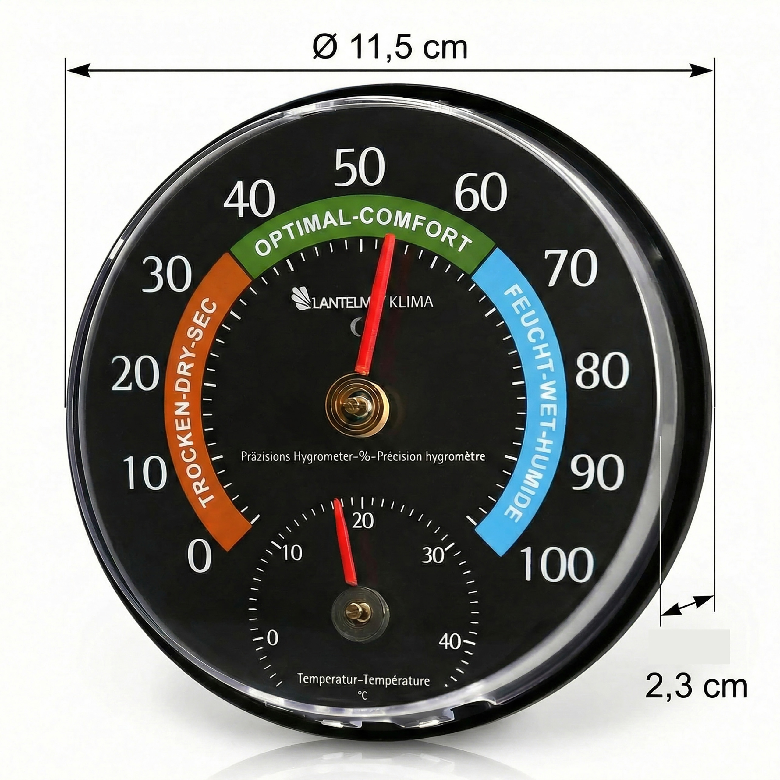 Ein schwarzes Hygrometer mit rotem Zeiger zeigt die Luftfeuchtigkeit an.