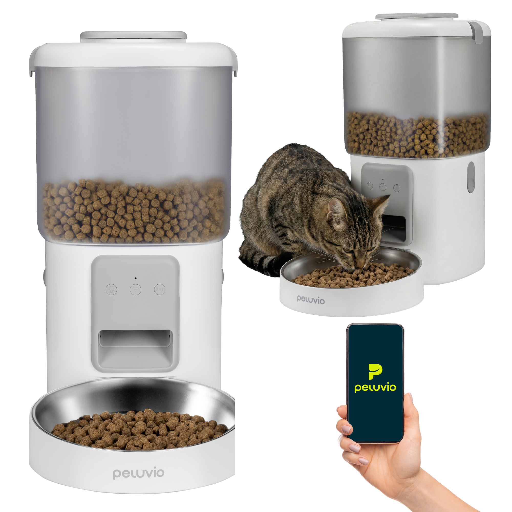 Ein gestreifter Kater frisst aus einem Futternapf neben einem weißen Futterspender und einem Smartphone.