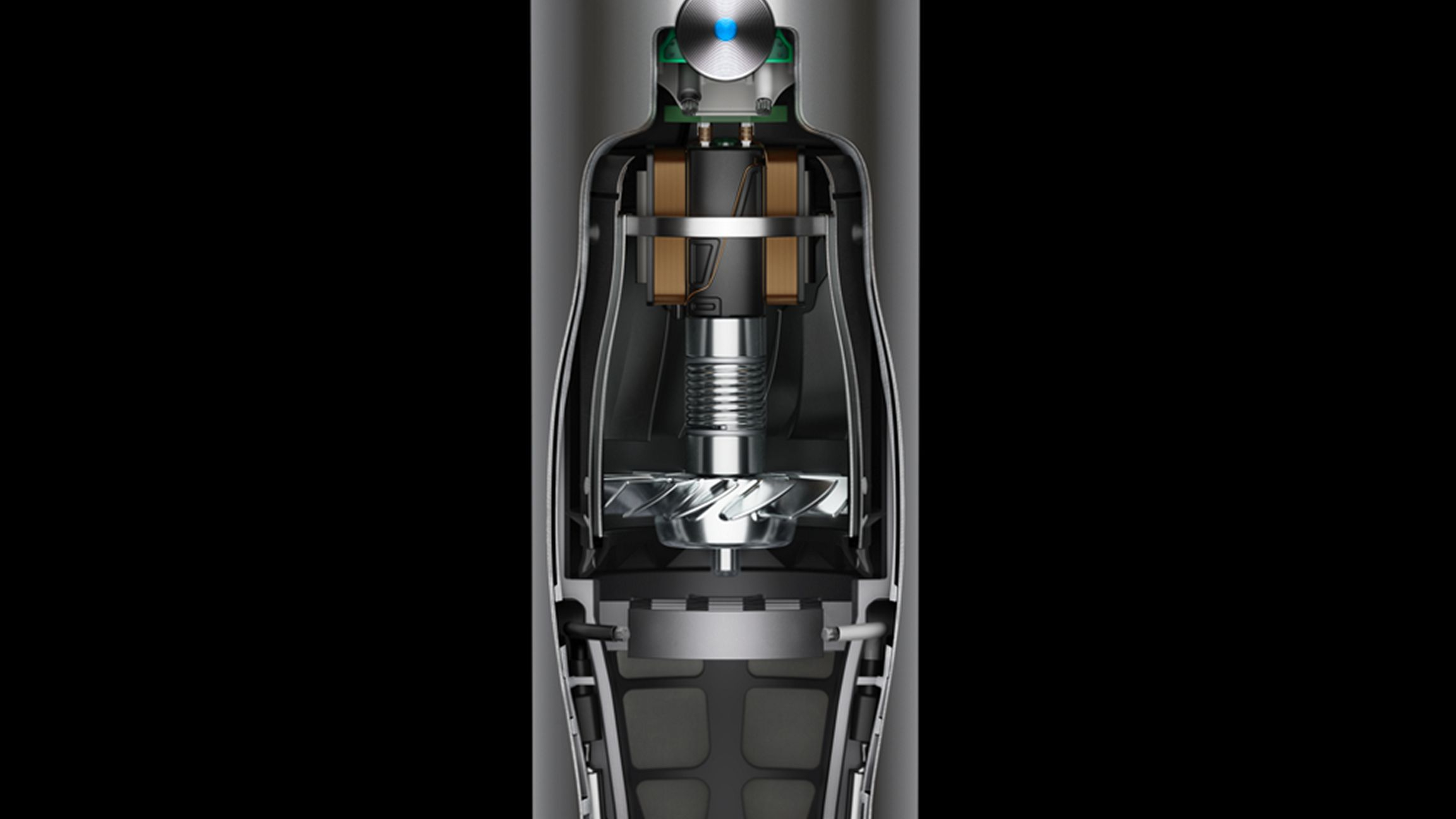 Cutaway view of a motor with coils, fan, and electronic components.