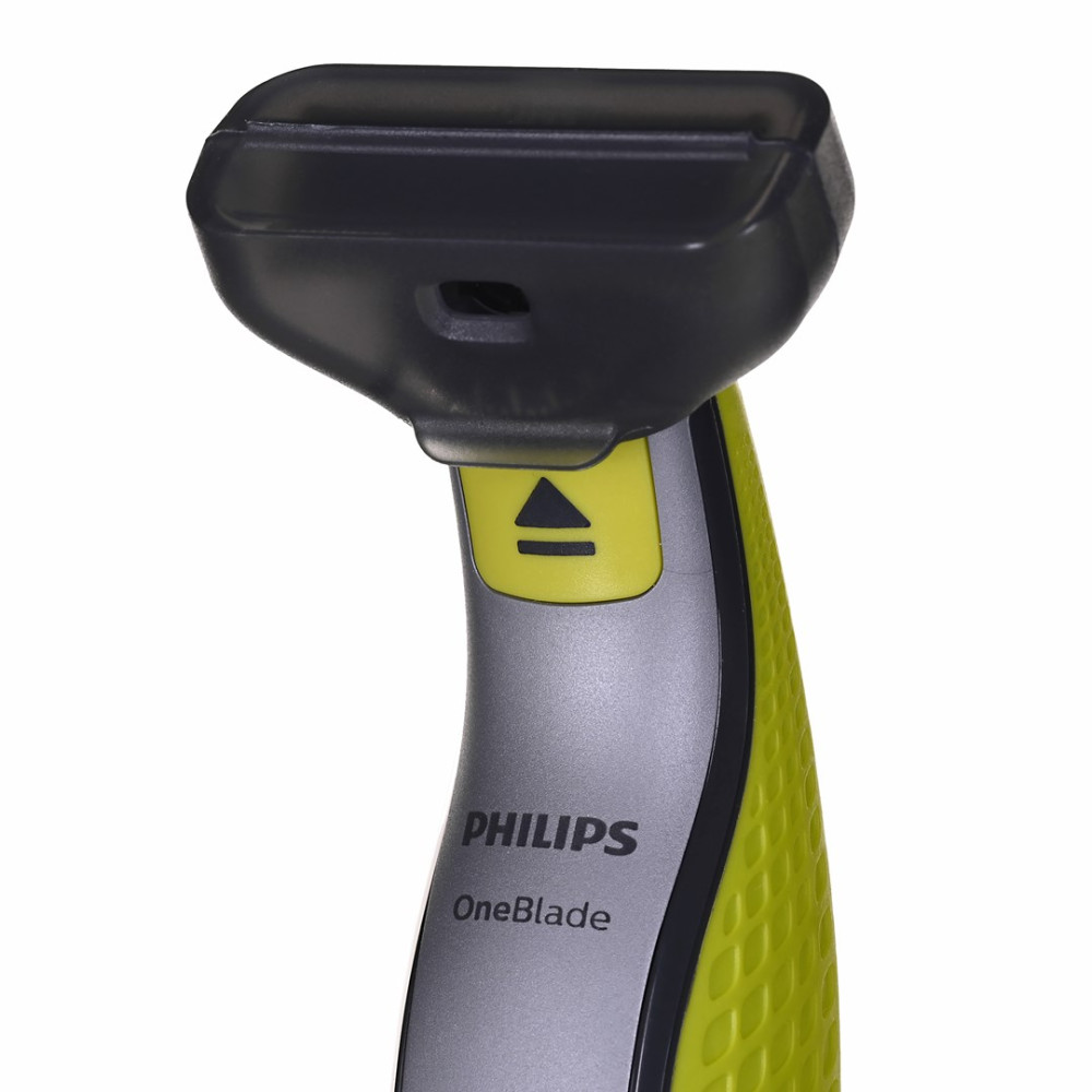 Zbliżenie trymera Philips OneBlade z czarną nasadką i żółtymi akcentami.