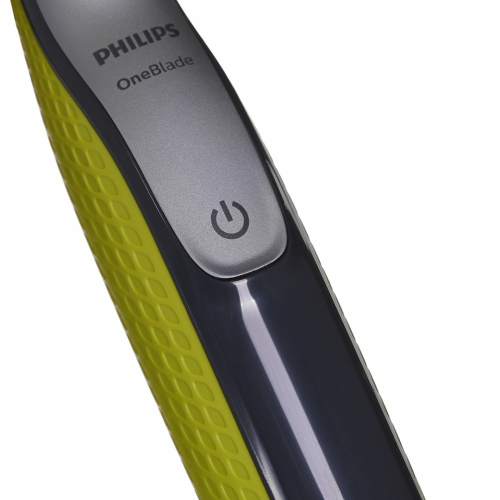 Zbliżenie trymera Philips OneBlade z żółtym uchwytem i przyciskiem zasilania.