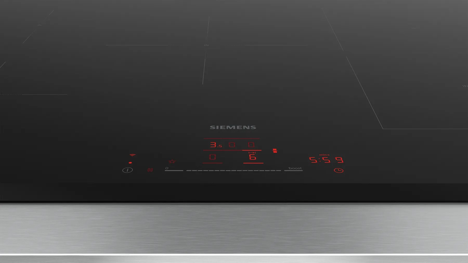 Piano cottura a induzione Siemens con display digitale rosso e comandi.