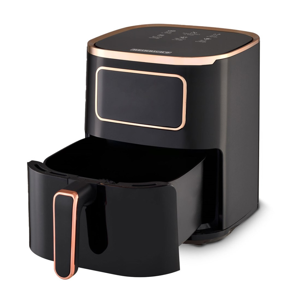 Czarna frytkownica beztłuszczowa z różowo-złotym wykończeniem. Wyjęty kosz.