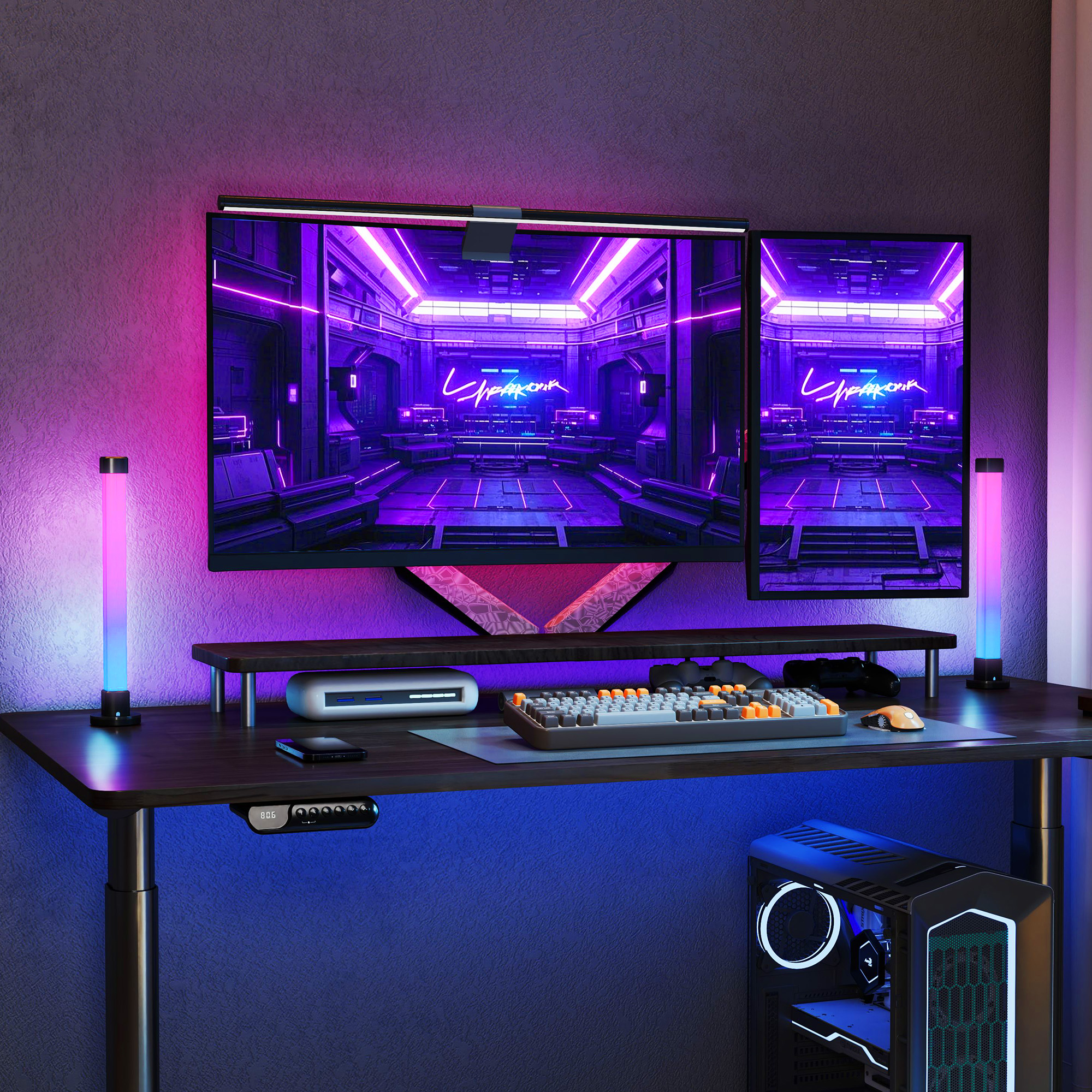 Un escritorio con dos monitores, teclado, ratón y caja de PC, iluminado por luces de neón.