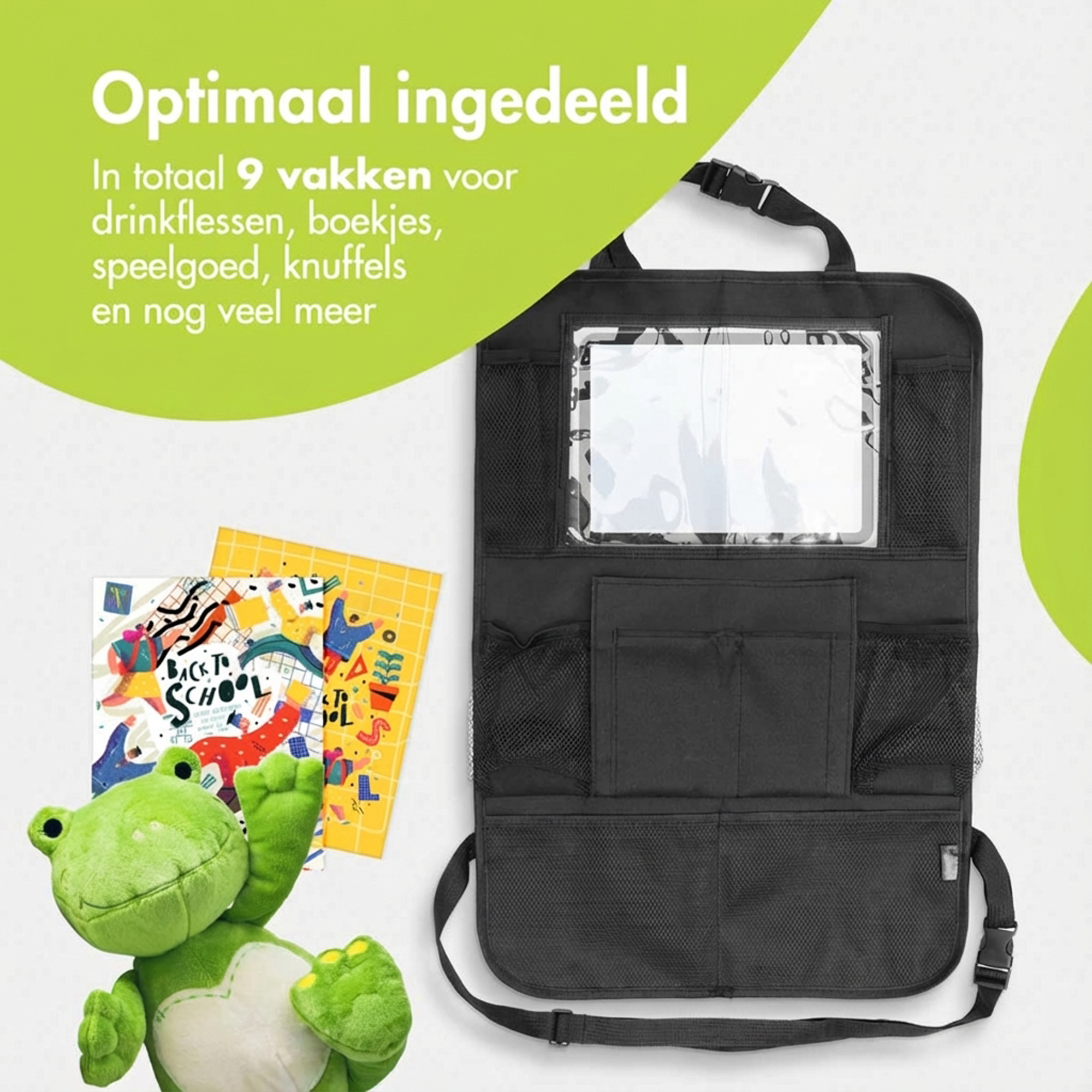 Een groene pluche kikker zit naast een zwarte auto-organizer met vakken.