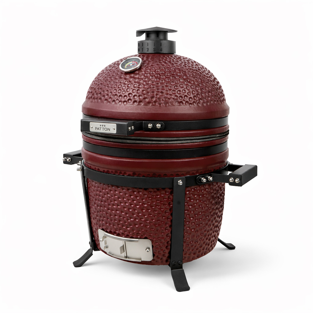 Ein roter Keramikgrill mit schwarzem Metallgestell und Thermometer.