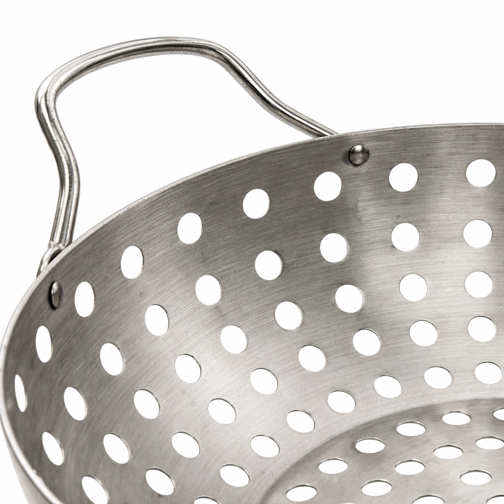 Close-up of a round, metal grill basket with holes and a curved handle.