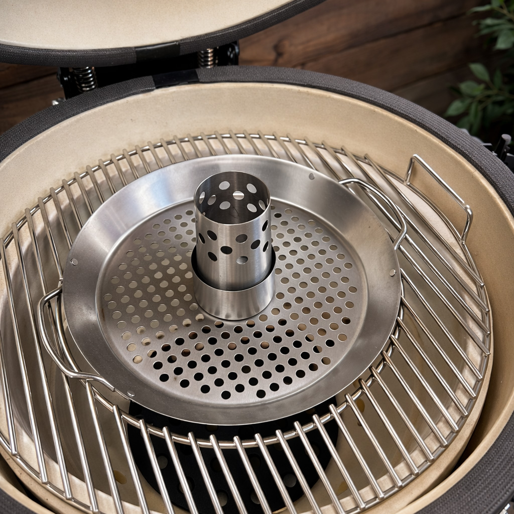 A grill rack with a perforated plate insert and a cylindrical insert.