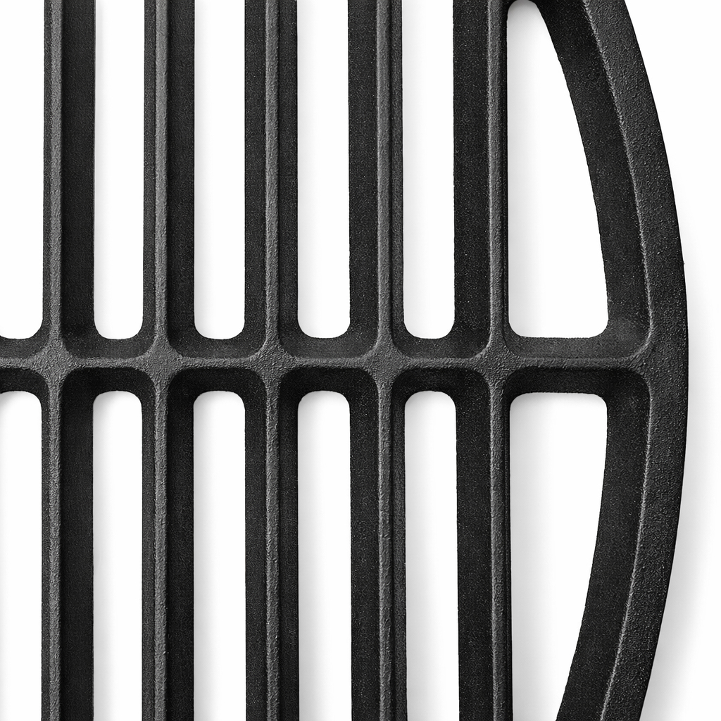 A close-up shot shows a black grill grate with vertical bars and a curved right edge against a white background.