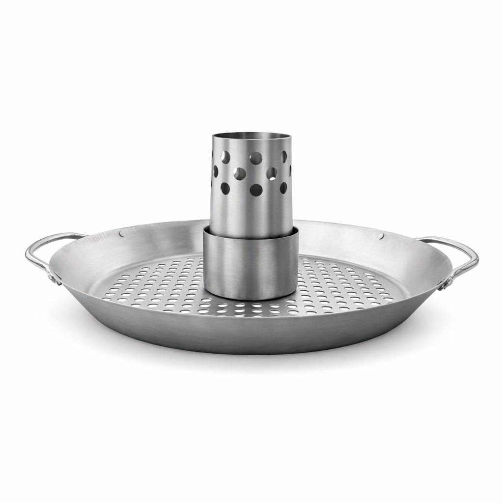 A shiny silver metal pan with small holes on its surface, and a cylindrical insert in the center.