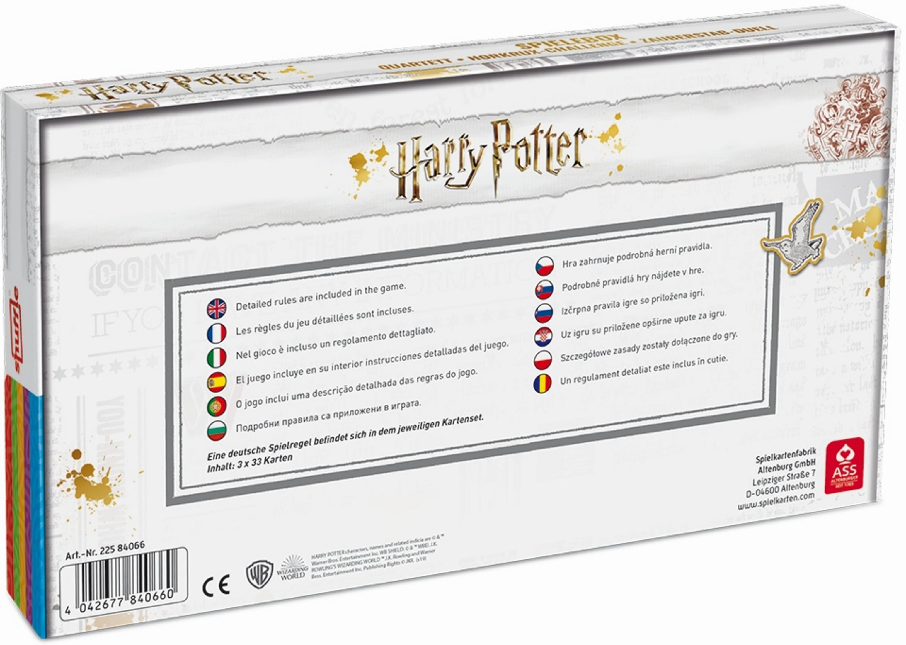Eine weiße Harry Potter Spielbox mit dem Titel in Gold und Tintenklecksen sowie einer Liste der Regeln in mehreren Sprachen.